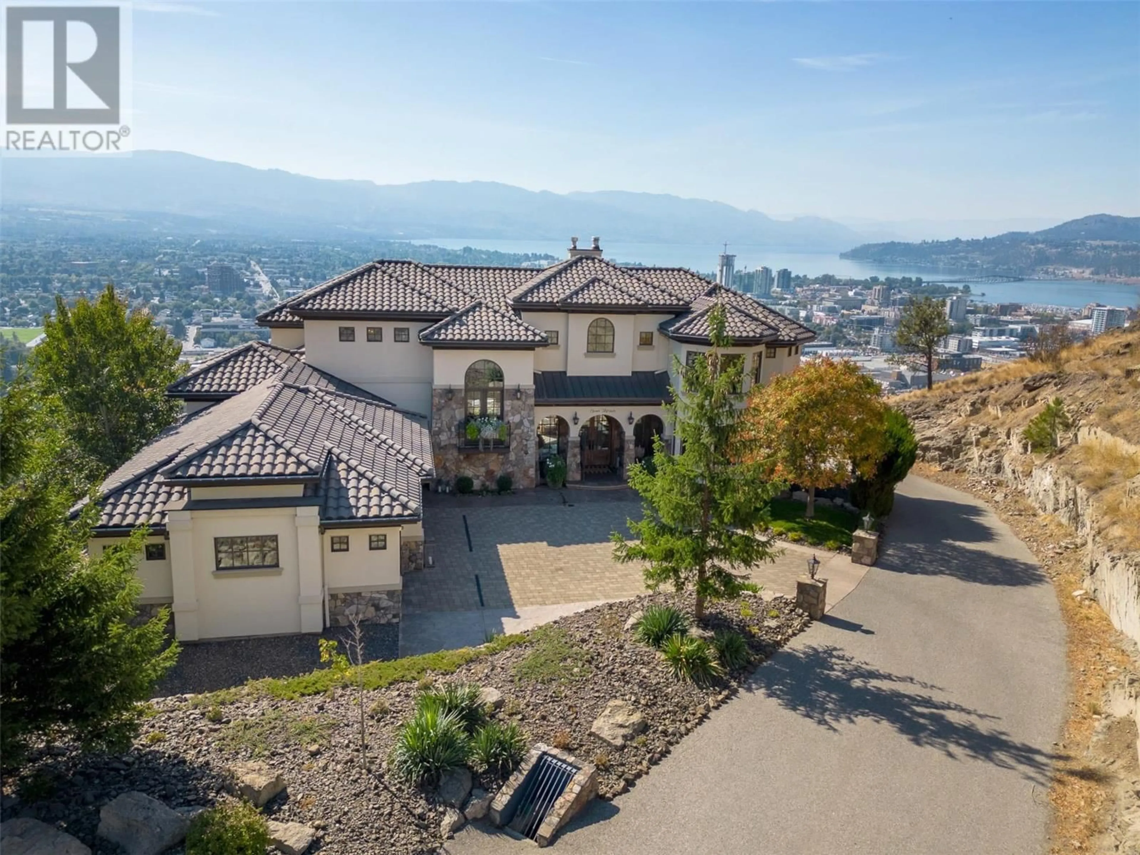 A pic from outside/outdoor area/front of a property/back of a property/a pic from drone, mountain view for 1113 PARKBLUFF LANE, Kelowna British Columbia V1V2Y3
