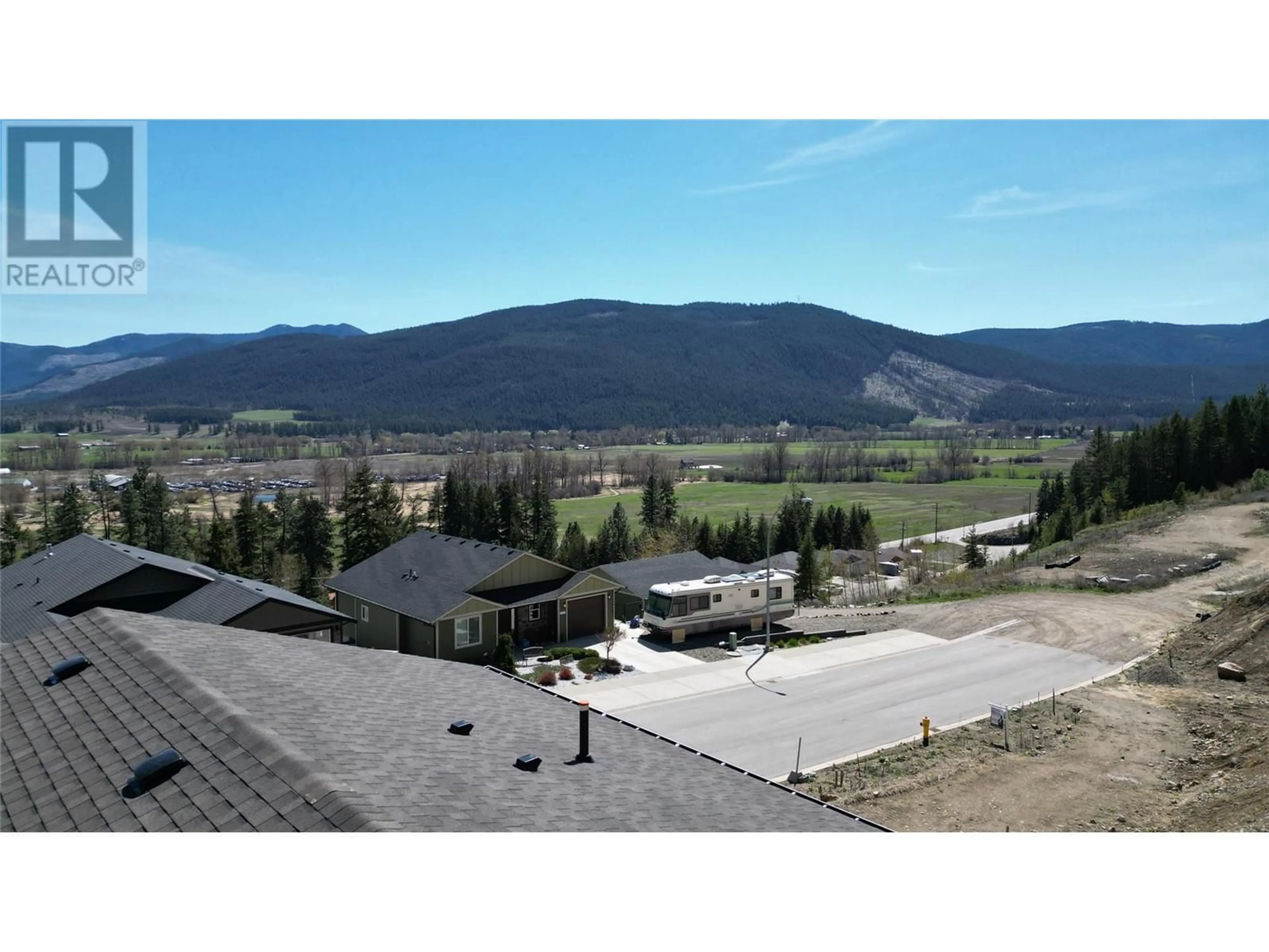 A pic from outside/outdoor area/front of a property/back of a property/a pic from drone, mountain view for 1768 GALLON AVENUE, Lumby British Columbia V0E2G0