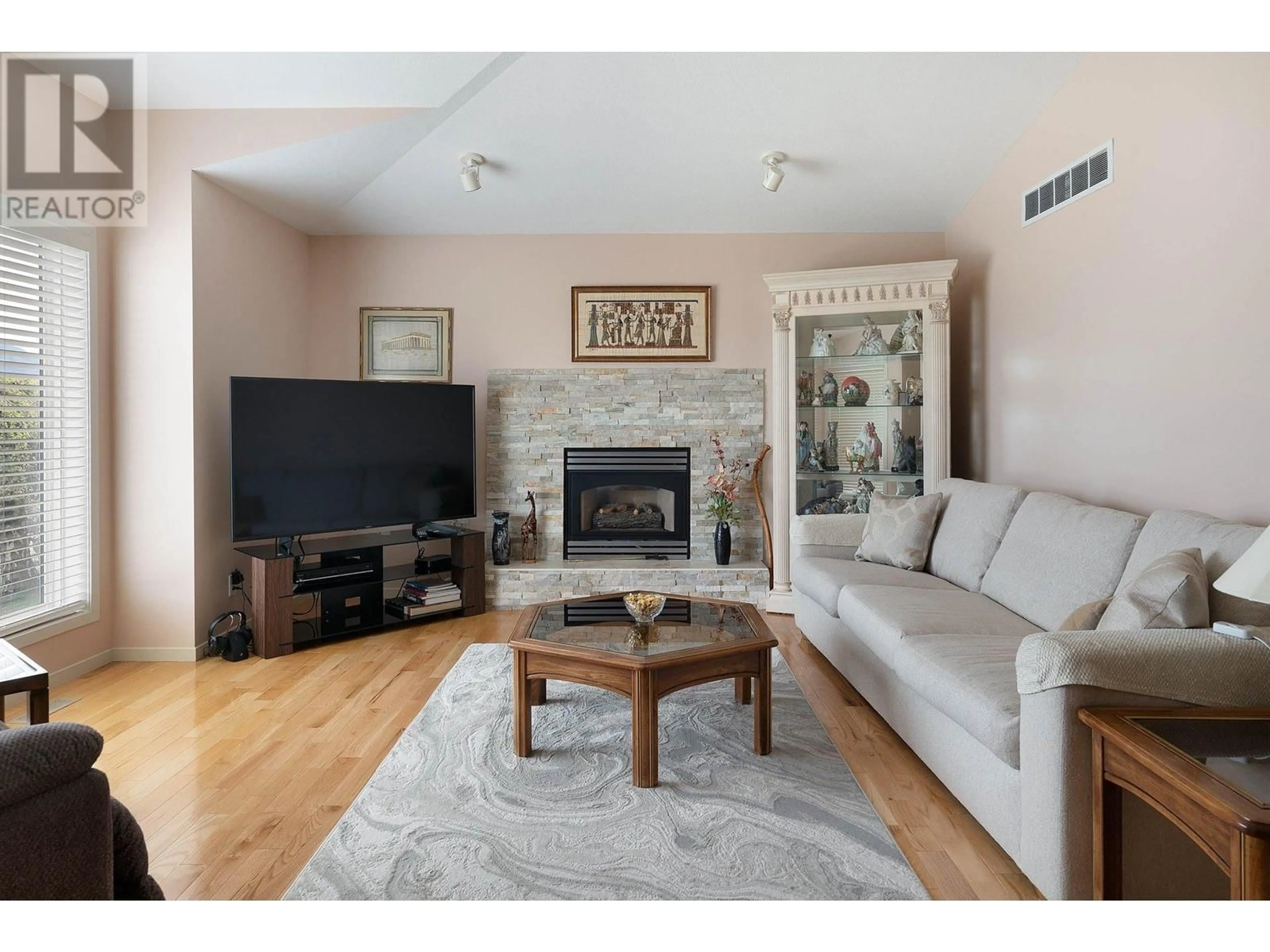 Living room with furniture, wood/laminate floor for 3336 CHANCELLOR PLACE, West Kelowna British Columbia V4T2R1