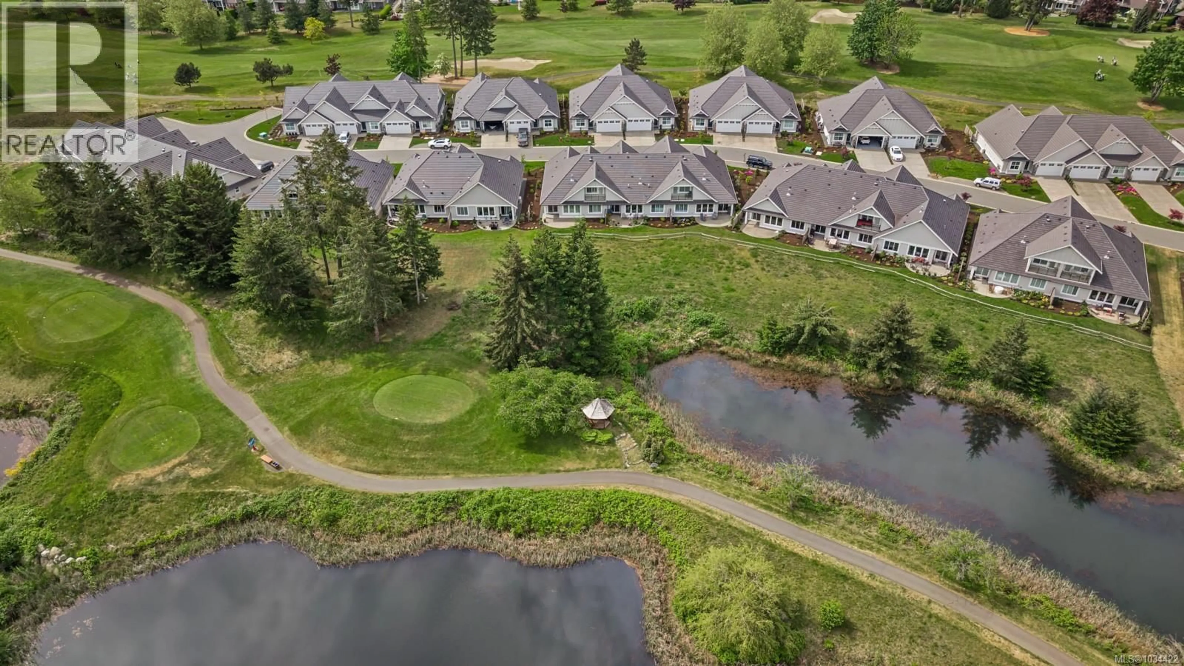 A pic from outside/outdoor area/front of a property/back of a property/a pic from drone, water/lake/river/ocean view for 130 - 1444 CROWN ISLE DRIVE, Courtenay British Columbia V9N0B8