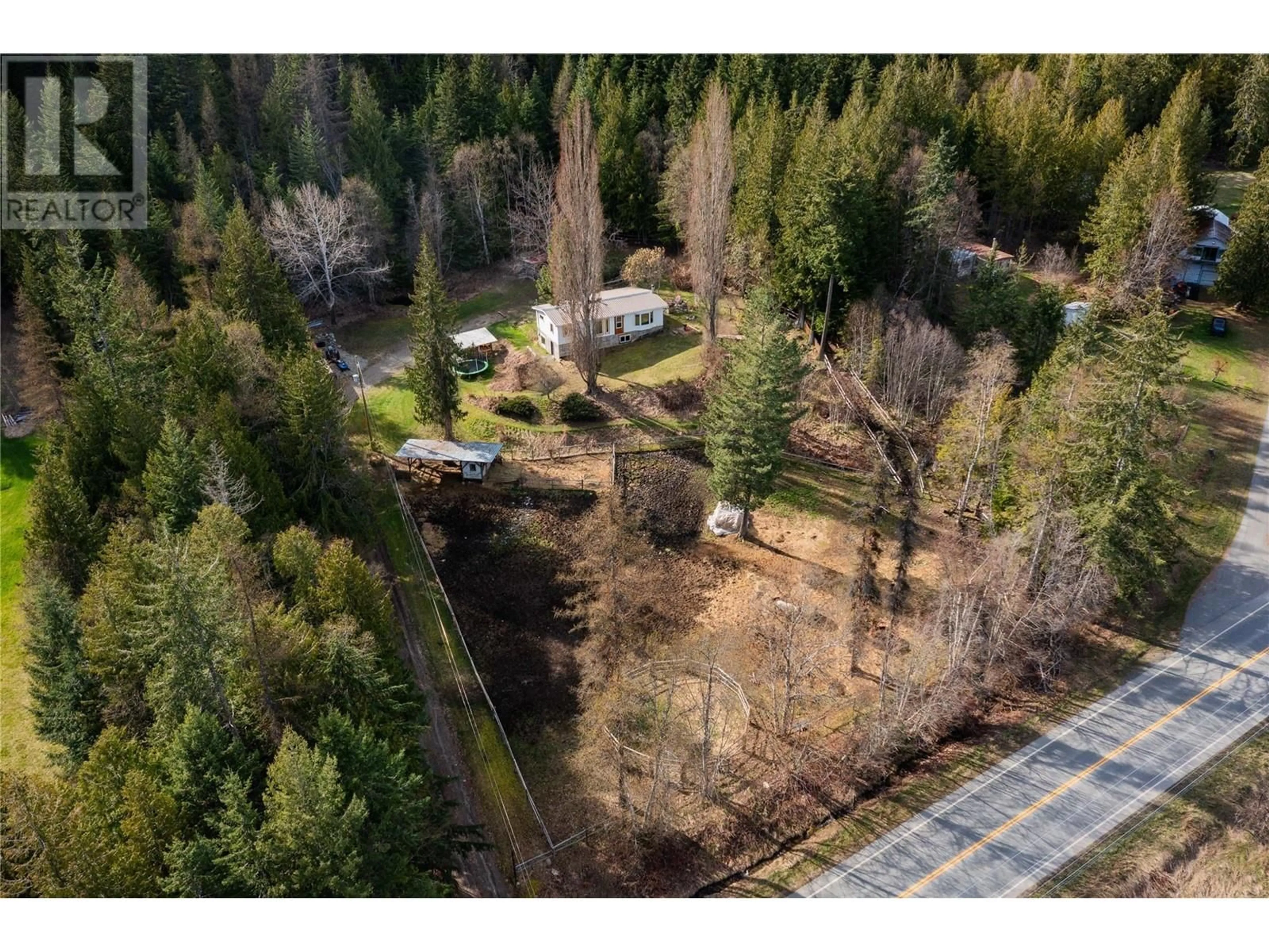 A pic from outside/outdoor area/front of a property/back of a property/a pic from drone, forest/trees view for 9351 31 HIGHWAY, Kaslo British Columbia V0G1M0
