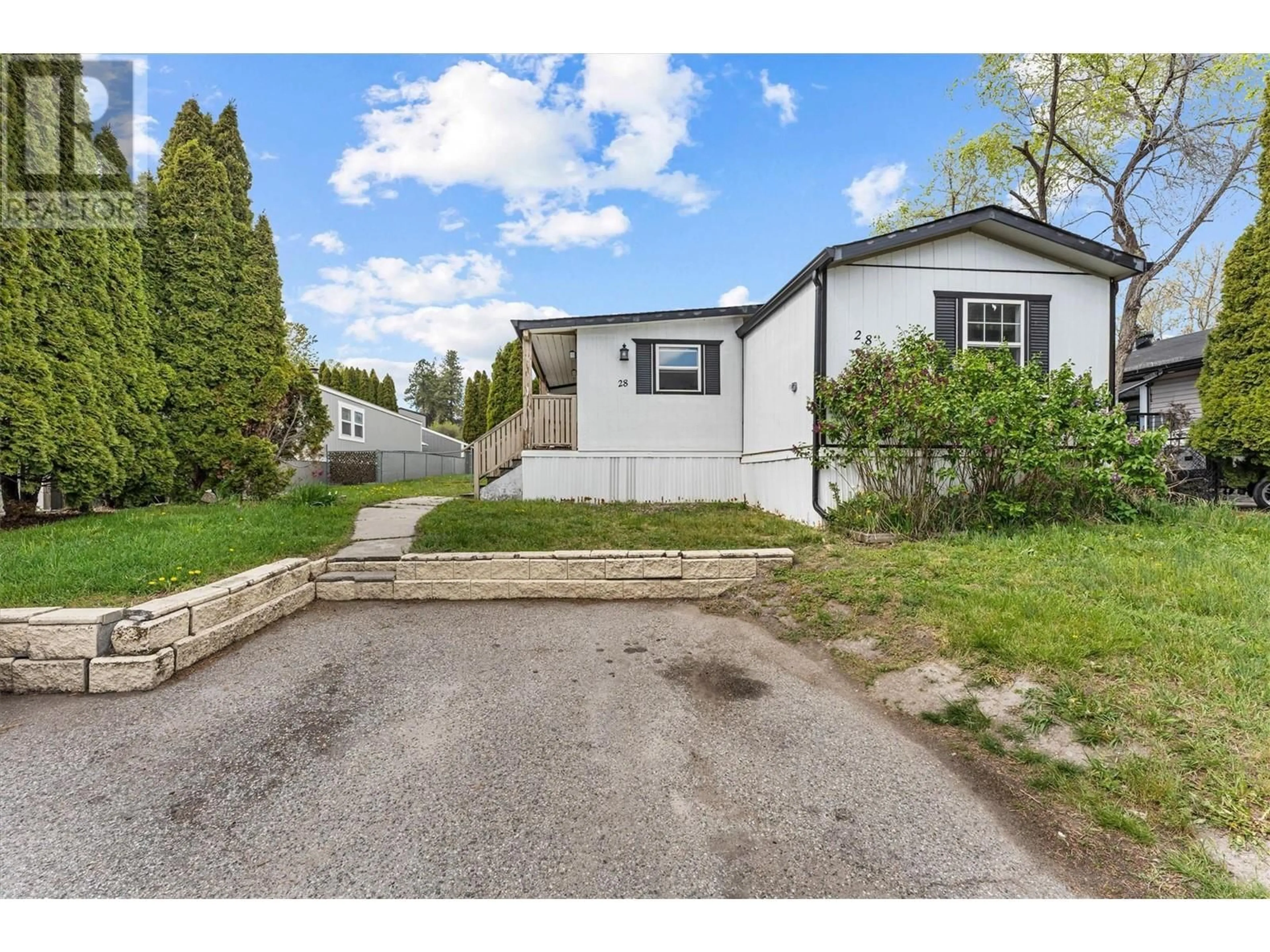 A pic from outside/outdoor area/front of a property/back of a property/a pic from drone, street for 28 - 3381 VILLAGE GREEN WAY, Westbank British Columbia V4T1L2