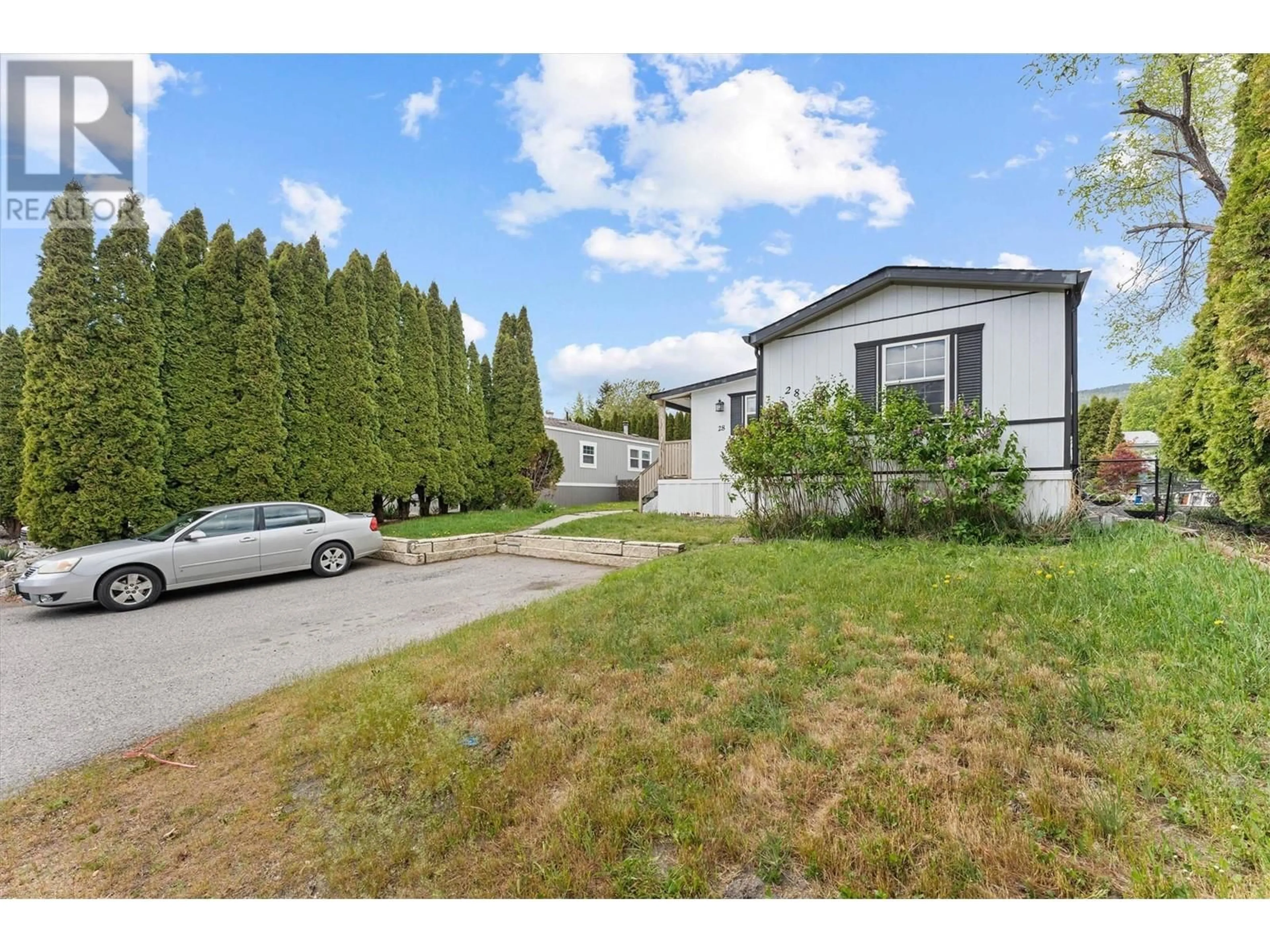 A pic from outside/outdoor area/front of a property/back of a property/a pic from drone, street for 28 - 3381 VILLAGE GREEN WAY, Westbank British Columbia V4T1L2