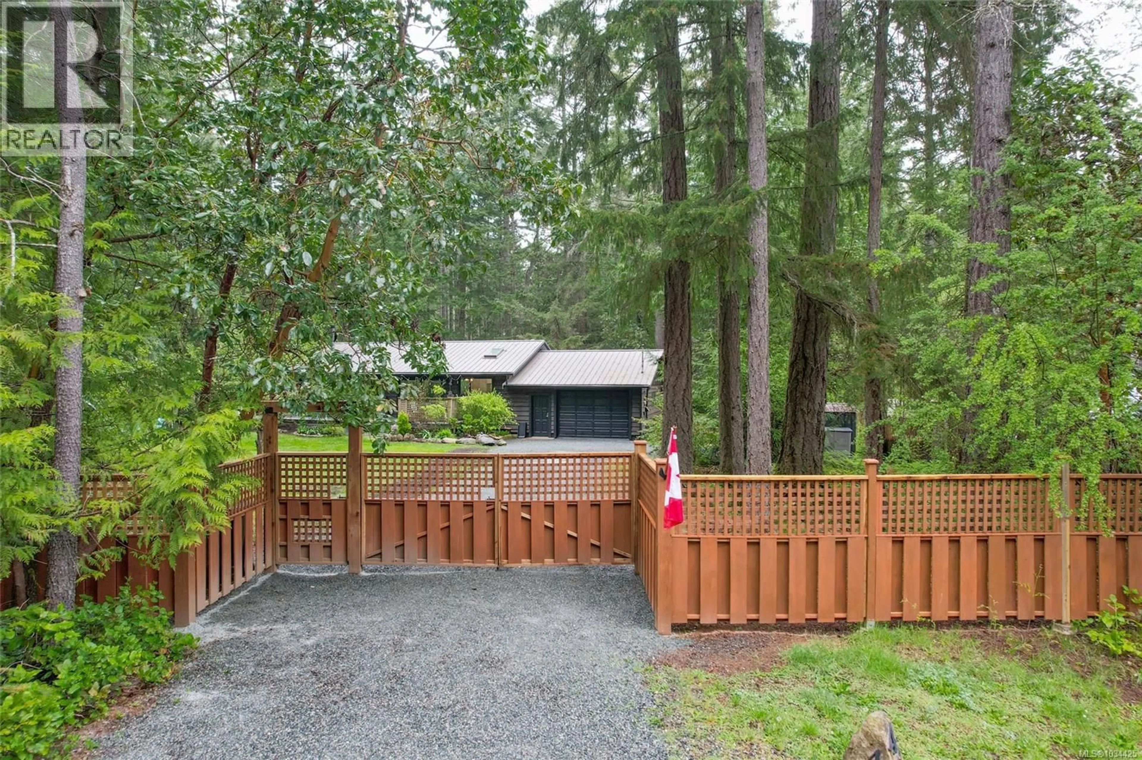 A pic from outside/outdoor area/front of a property/back of a property/a pic from drone, forest/trees view for 438 DUNSHIRE DRIVE, Gabriola Island British Columbia V0R1X2
