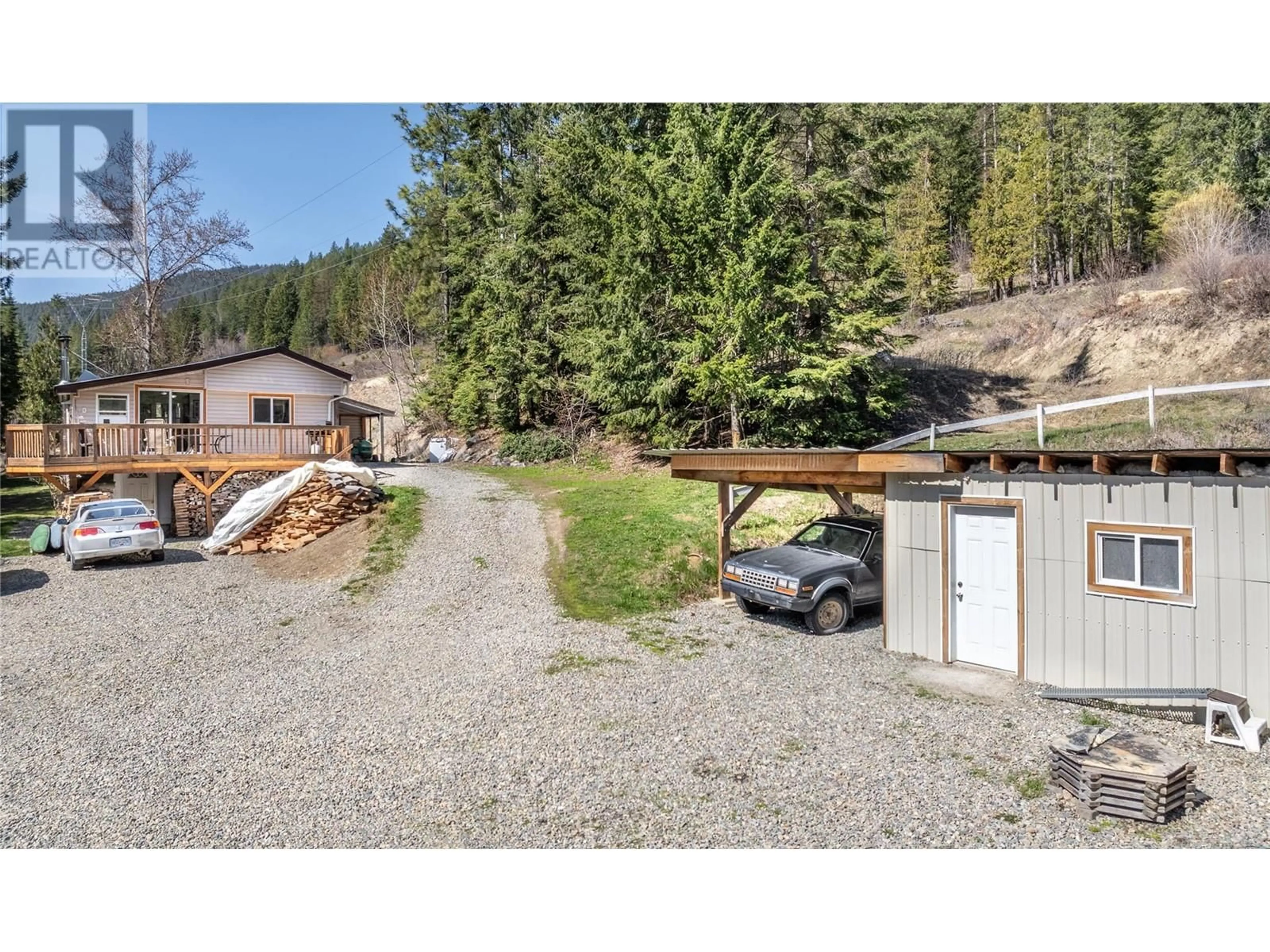 A pic from outside/outdoor area/front of a property/back of a property/a pic from drone, forest/trees view for 4720 GOAT RIVER  N ROAD, Arrow Creek British Columbia V0B1G8