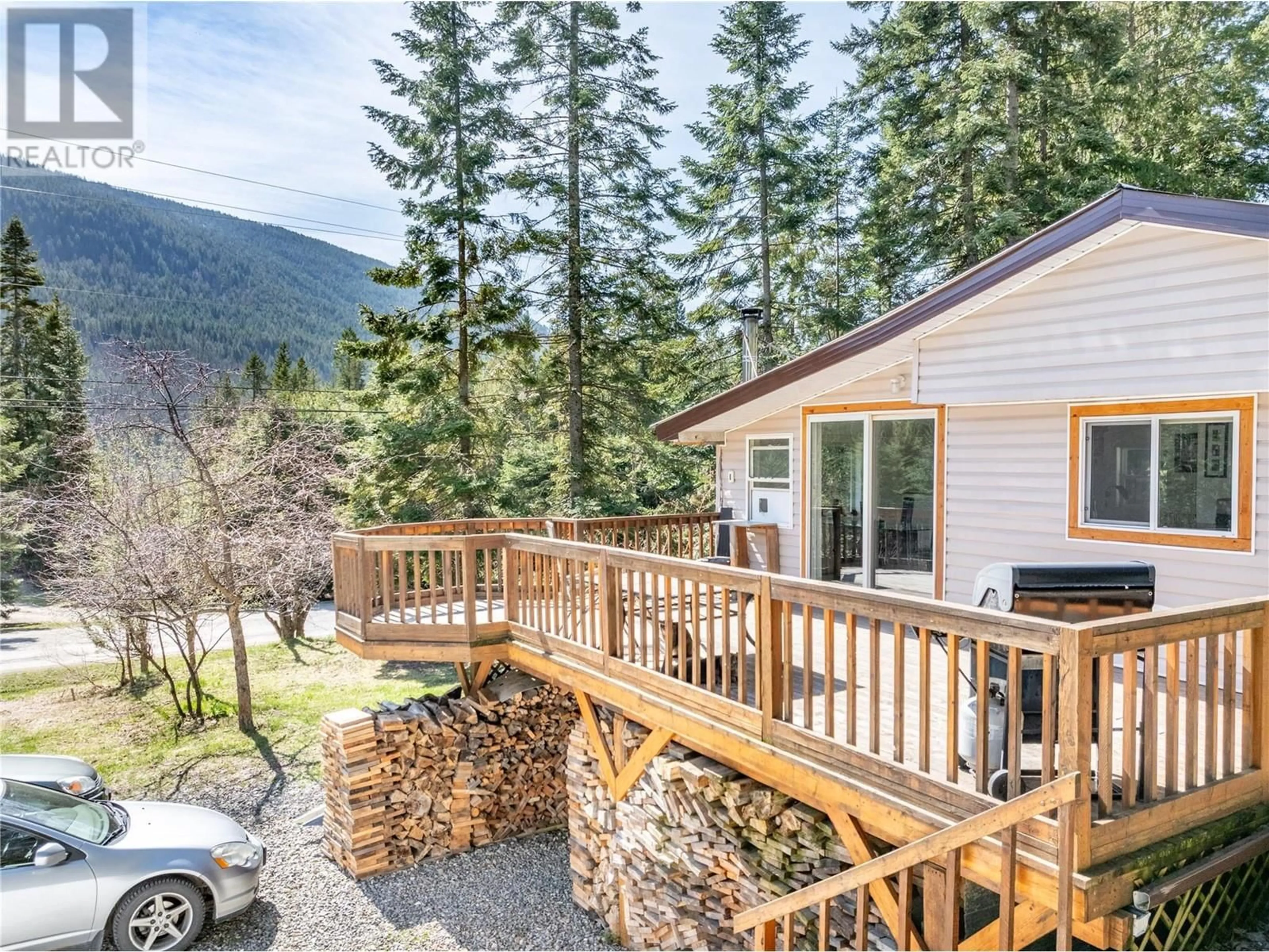 A pic from outside/outdoor area/front of a property/back of a property/a pic from drone, mountain view for 4720 GOAT RIVER  N ROAD, Arrow Creek British Columbia V0B1G8