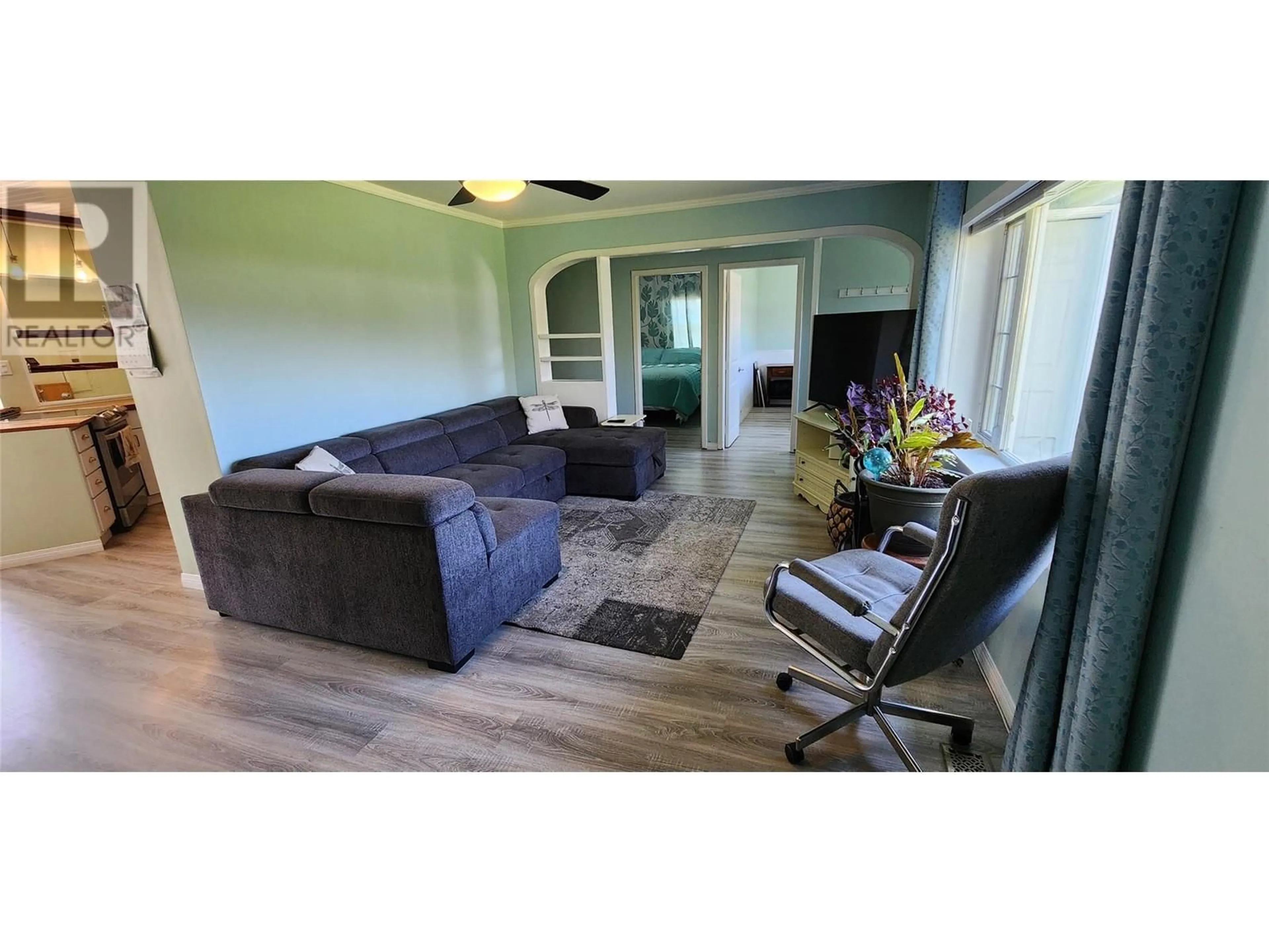Living room with furniture, wood/laminate floor for 580 CAMERON AVENUE, Grand Forks British Columbia V0H1H4