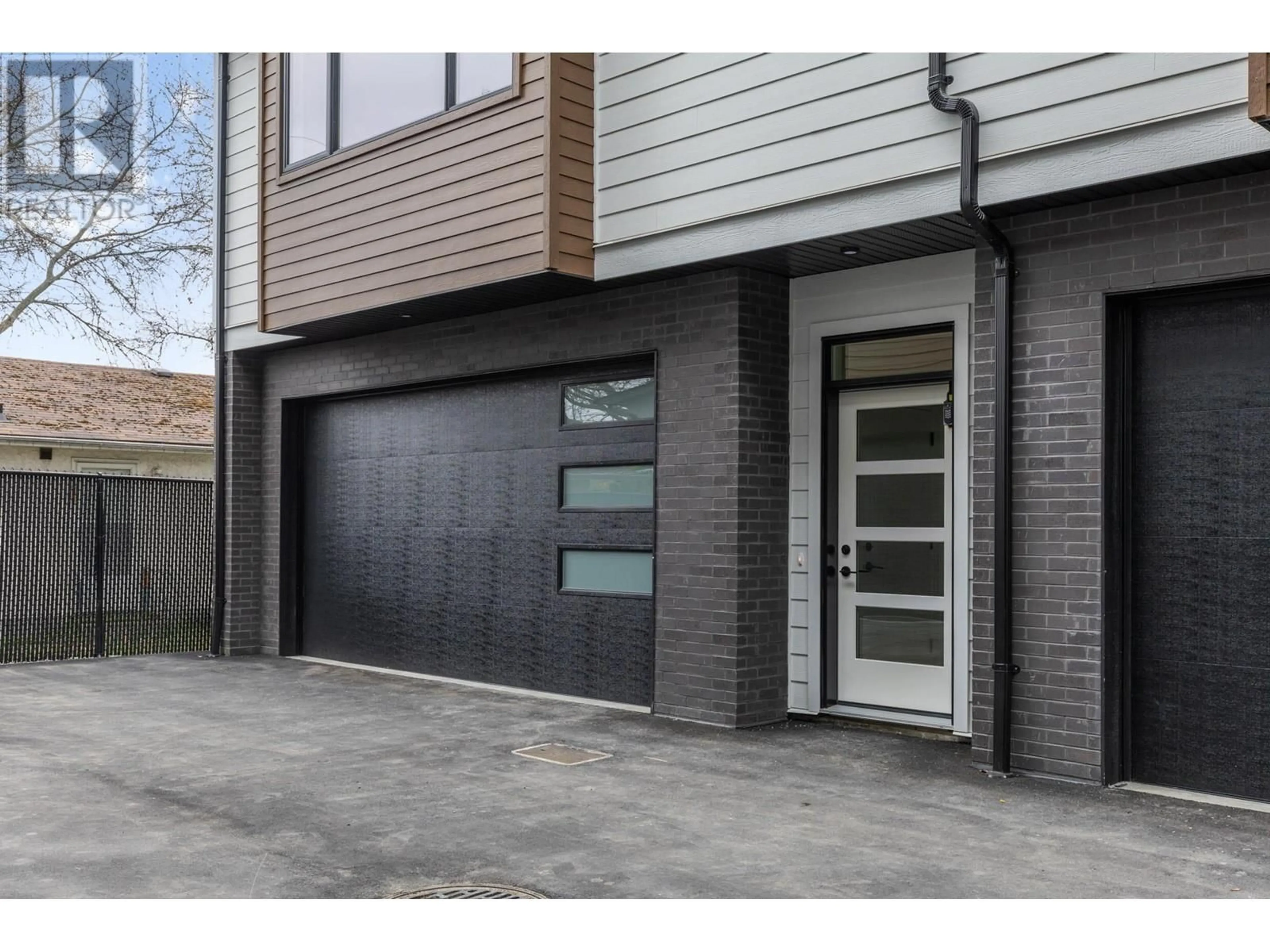 Home with brick exterior material, street for 6 - 1463 INKAR ROAD, Kelowna British Columbia V1Y8J1