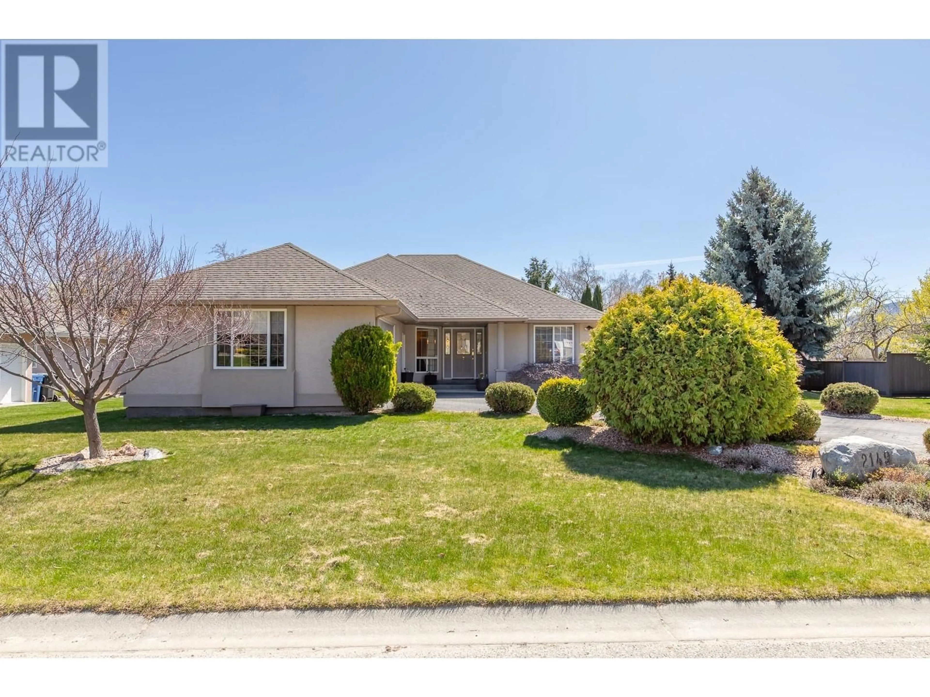 Home with vinyl exterior material, street for 2149 SANDSTONE DRIVE, Penticton British Columbia V2A8Y7