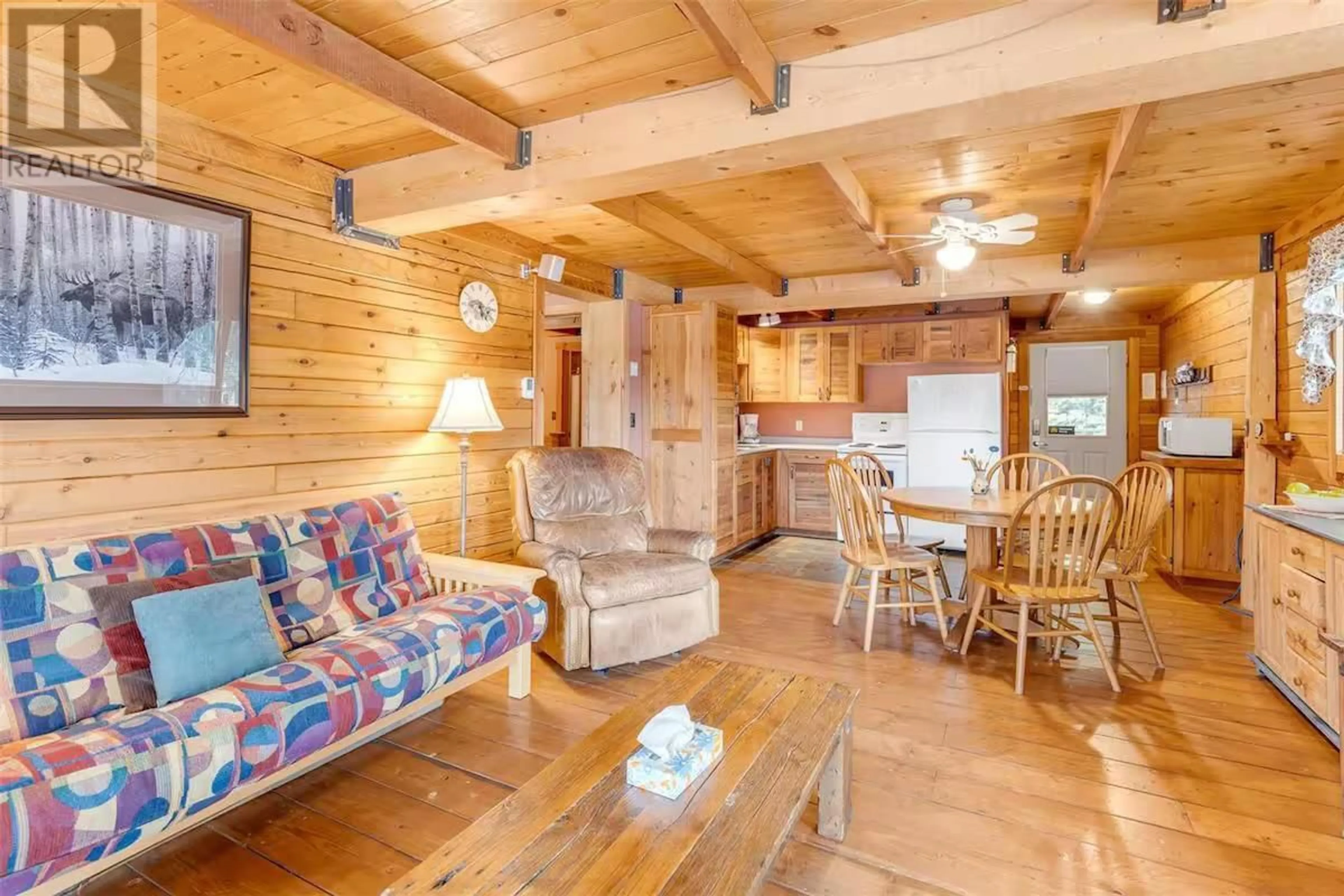 Living room with furniture, wood/laminate floor for 8 - 800 IDABEL LAKE ROAD, Kelowna British Columbia V1Y6H3