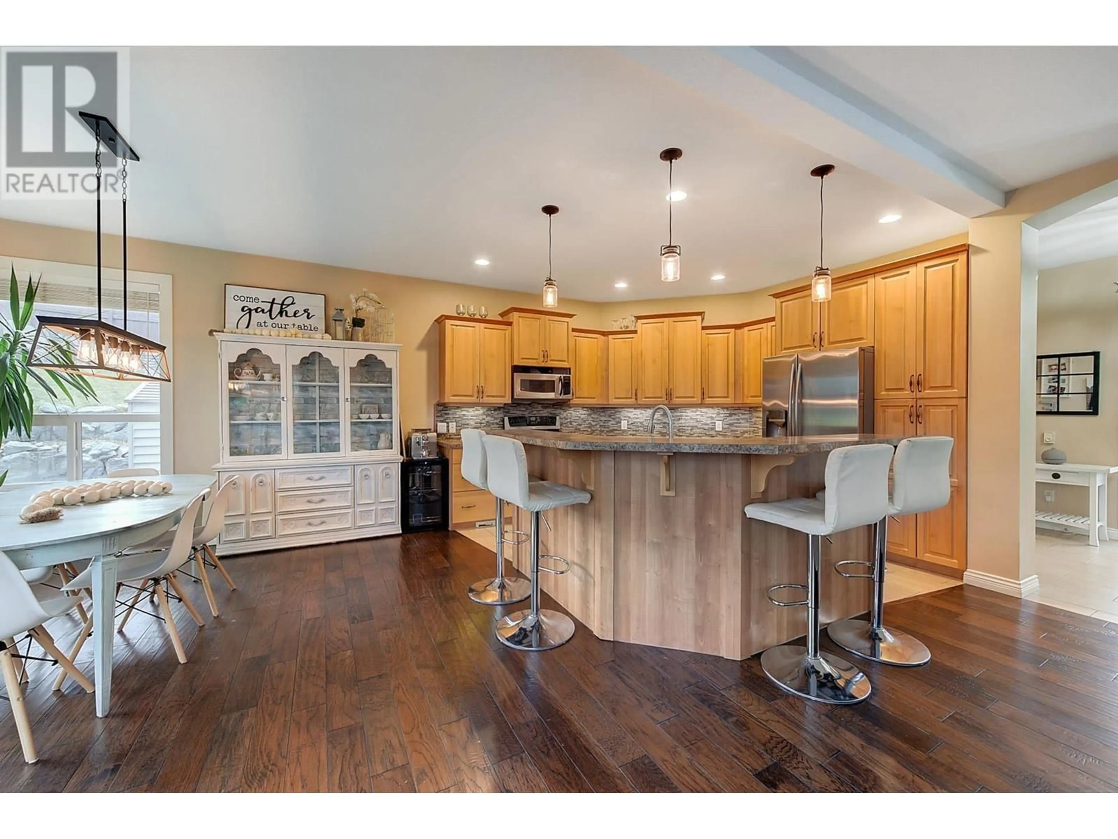 Open concept kitchen, wood/laminate floor for 4897 WARBLER COURT, Kelowna British Columbia V1W5A1