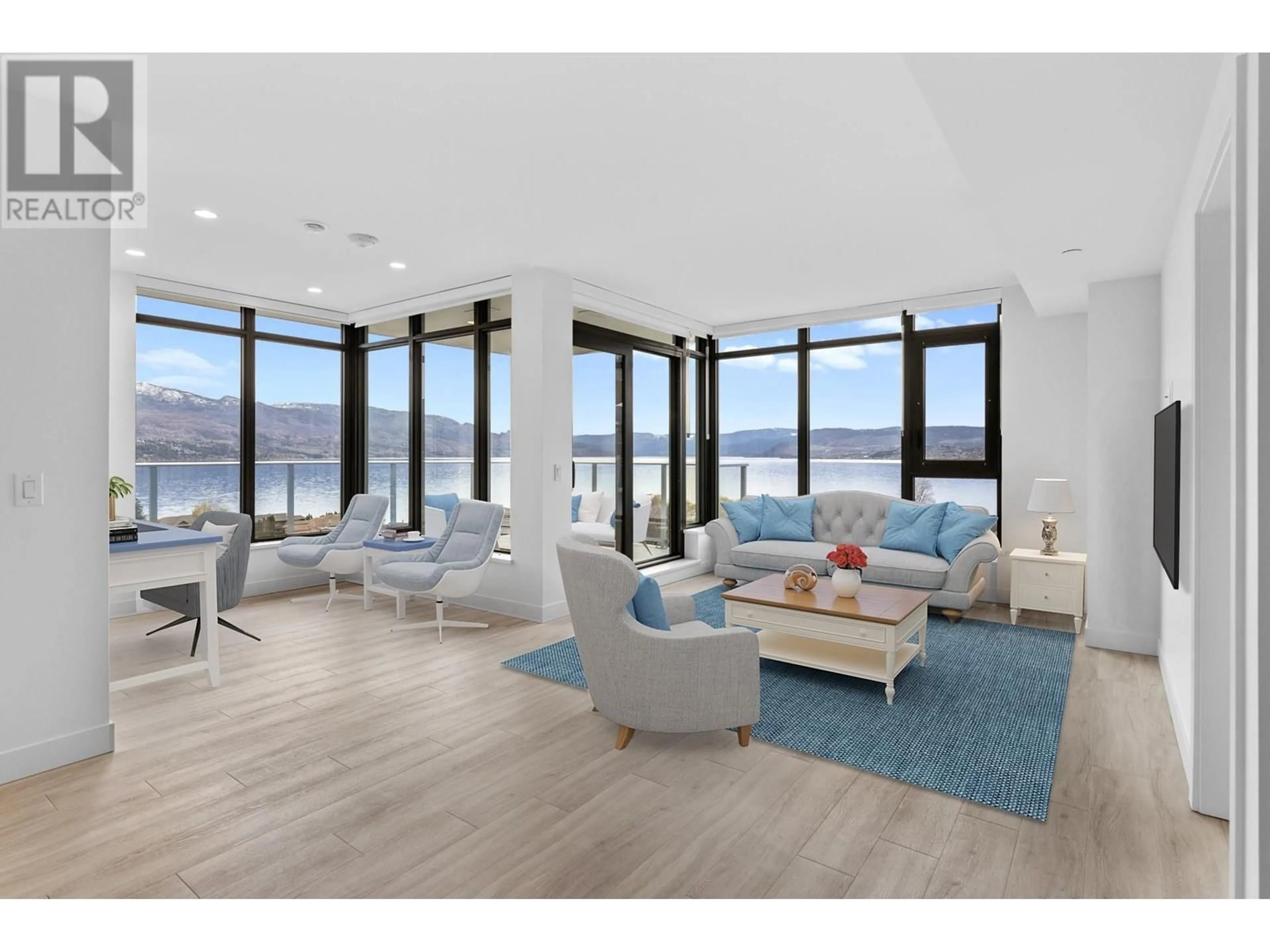 Living room with furniture, wood/laminate floor for 1207 - 3699 CAPOZZI ROAD, Kelowna British Columbia V1W0G3