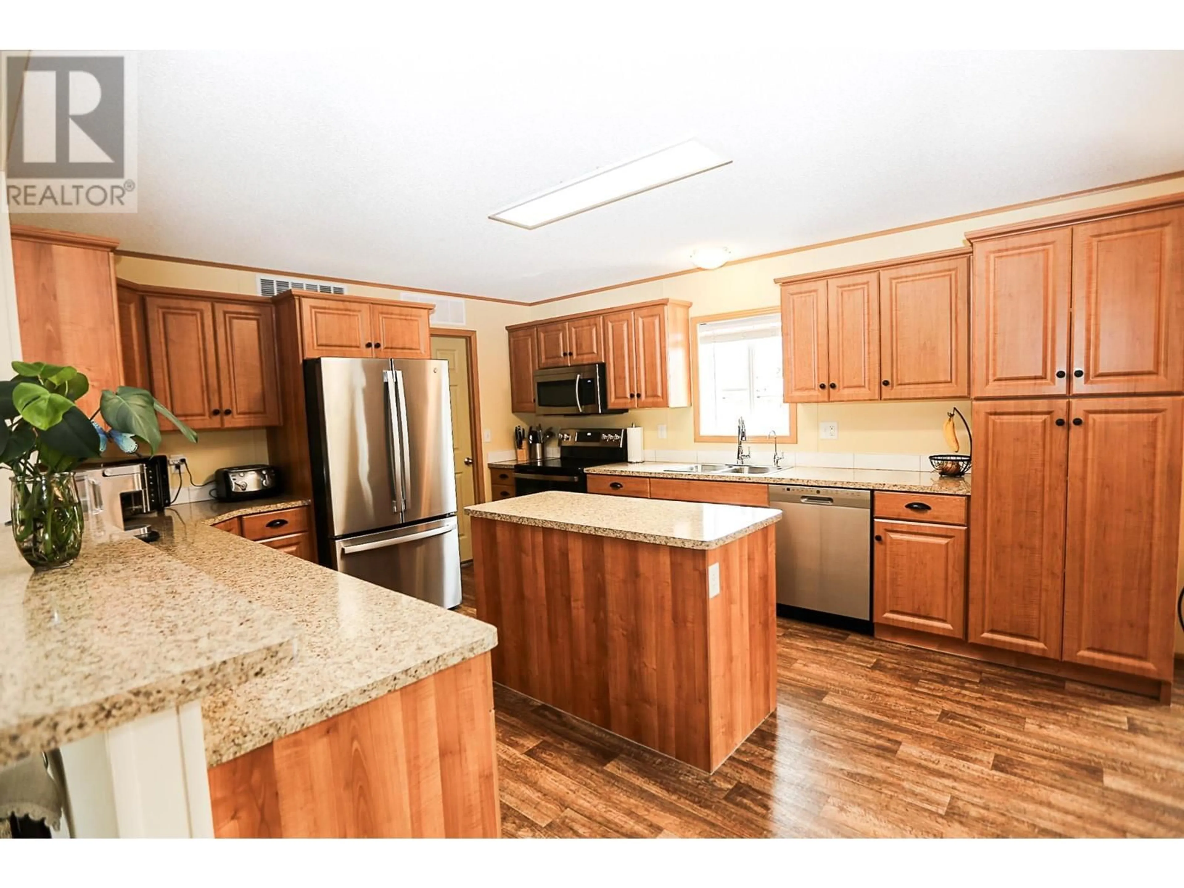 Open concept kitchen, wood/laminate floor for 440 SISKA DRIVE, Barriere British Columbia V0E1E0