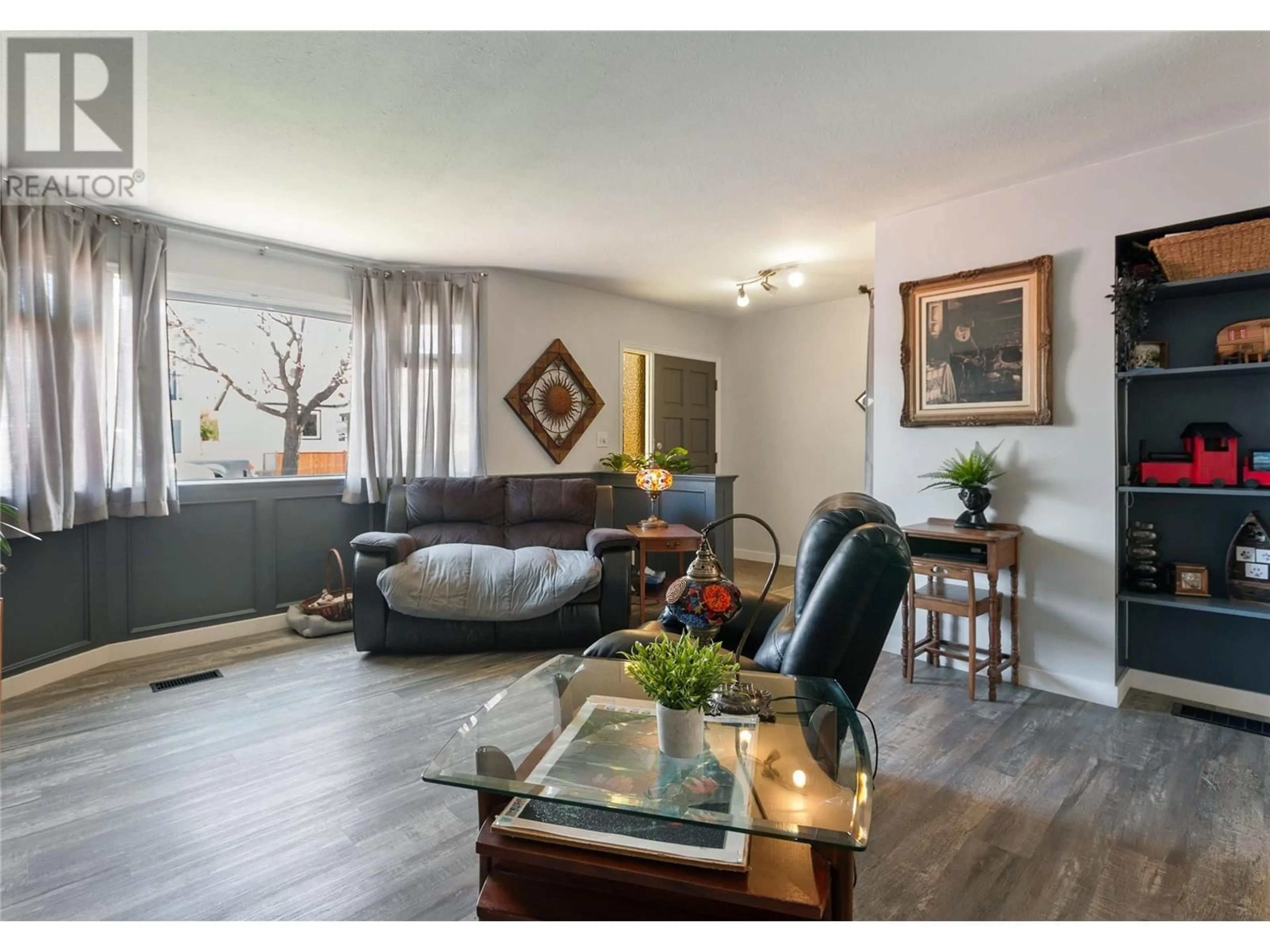 Living room with furniture, wood/laminate floor for 459 CARIBOU STREET, Penticton British Columbia V2A5W5
