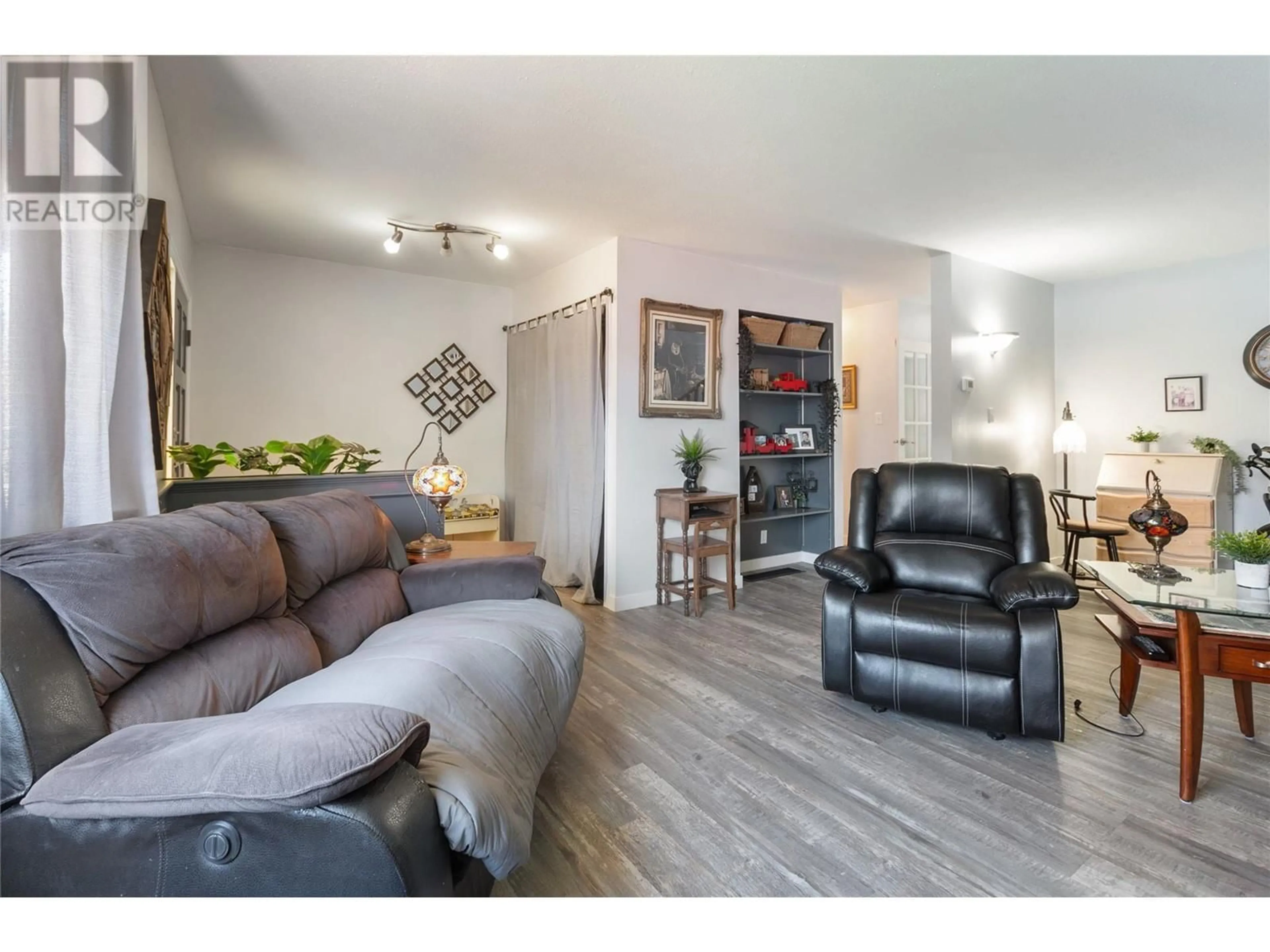 Living room with furniture, wood/laminate floor for 459 CARIBOU STREET, Penticton British Columbia V2A5W5