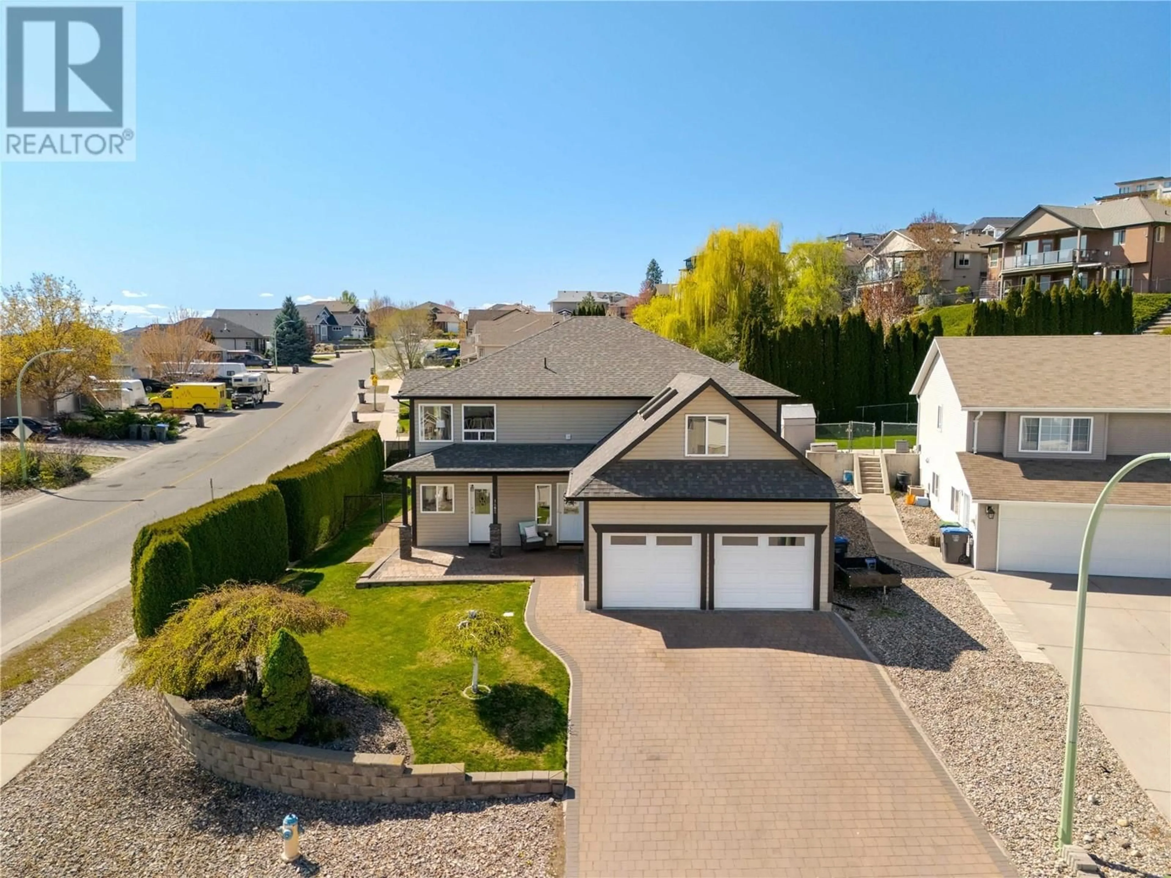 A pic from outside/outdoor area/front of a property/back of a property/a pic from drone, unknown for 1482 LONGLEY CRESCENT, Kelowna British Columbia V1P1N1