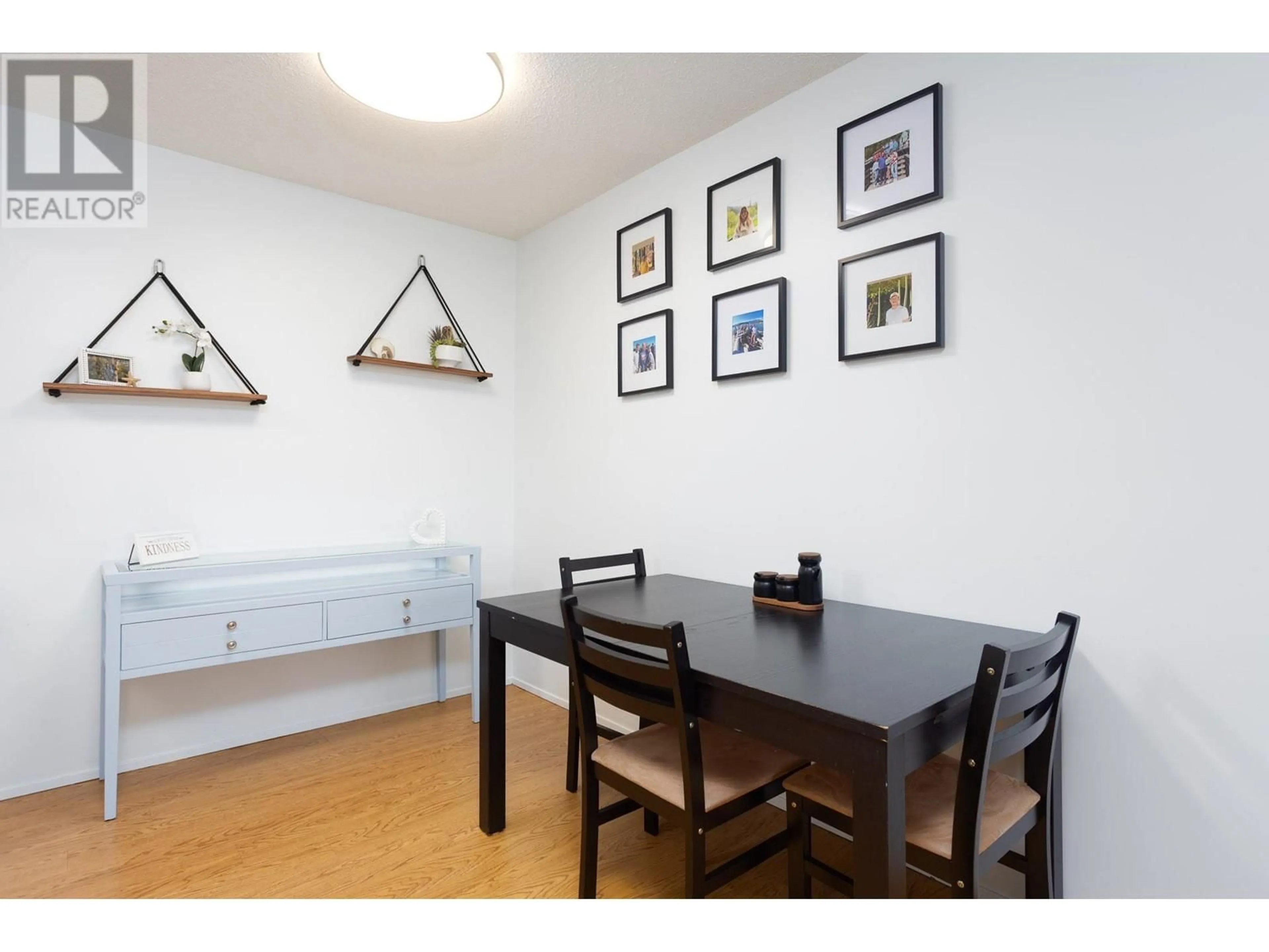Dining room, wood/laminate floor for 204 - 2085 GORDON DRIVE, Kelowna British Columbia V1Y8S1