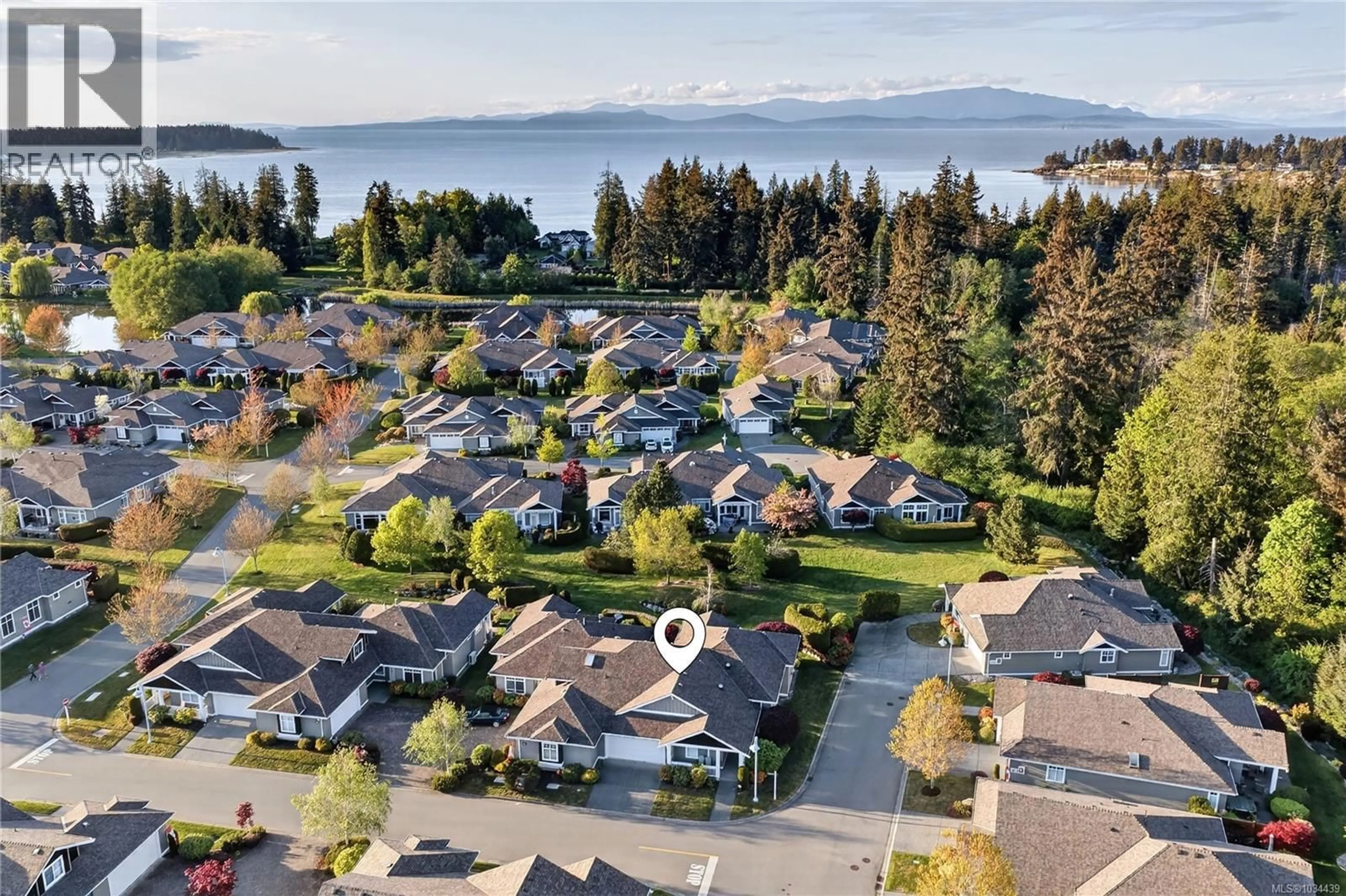 A pic from outside/outdoor area/front of a property/back of a property/a pic from drone, water/lake/river/ocean view for 1415 MADEIRA AVENUE, Parksville British Columbia V9P2Y6