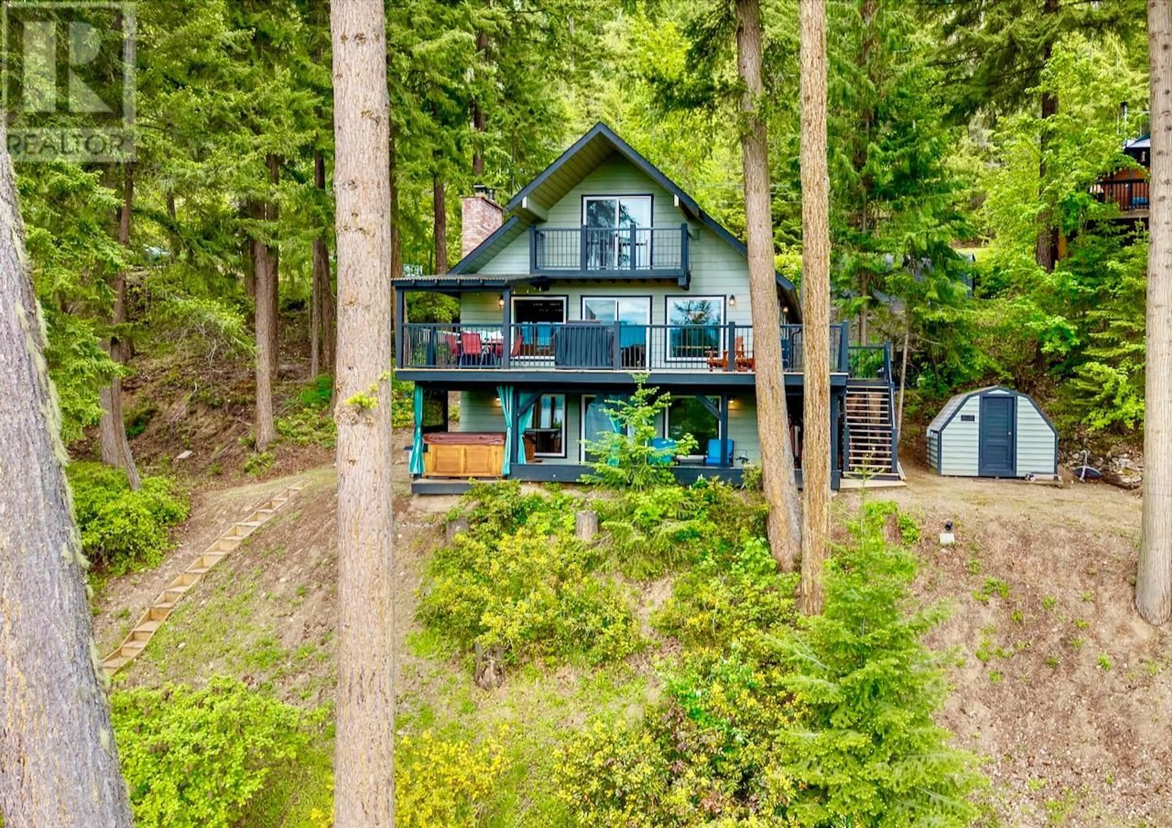 A pic from outside/outdoor area/front of a property/back of a property/a pic from drone, water/lake/river/ocean view for 7730 COLUMBIA DRIVE, Anglemont British Columbia V0E1M8