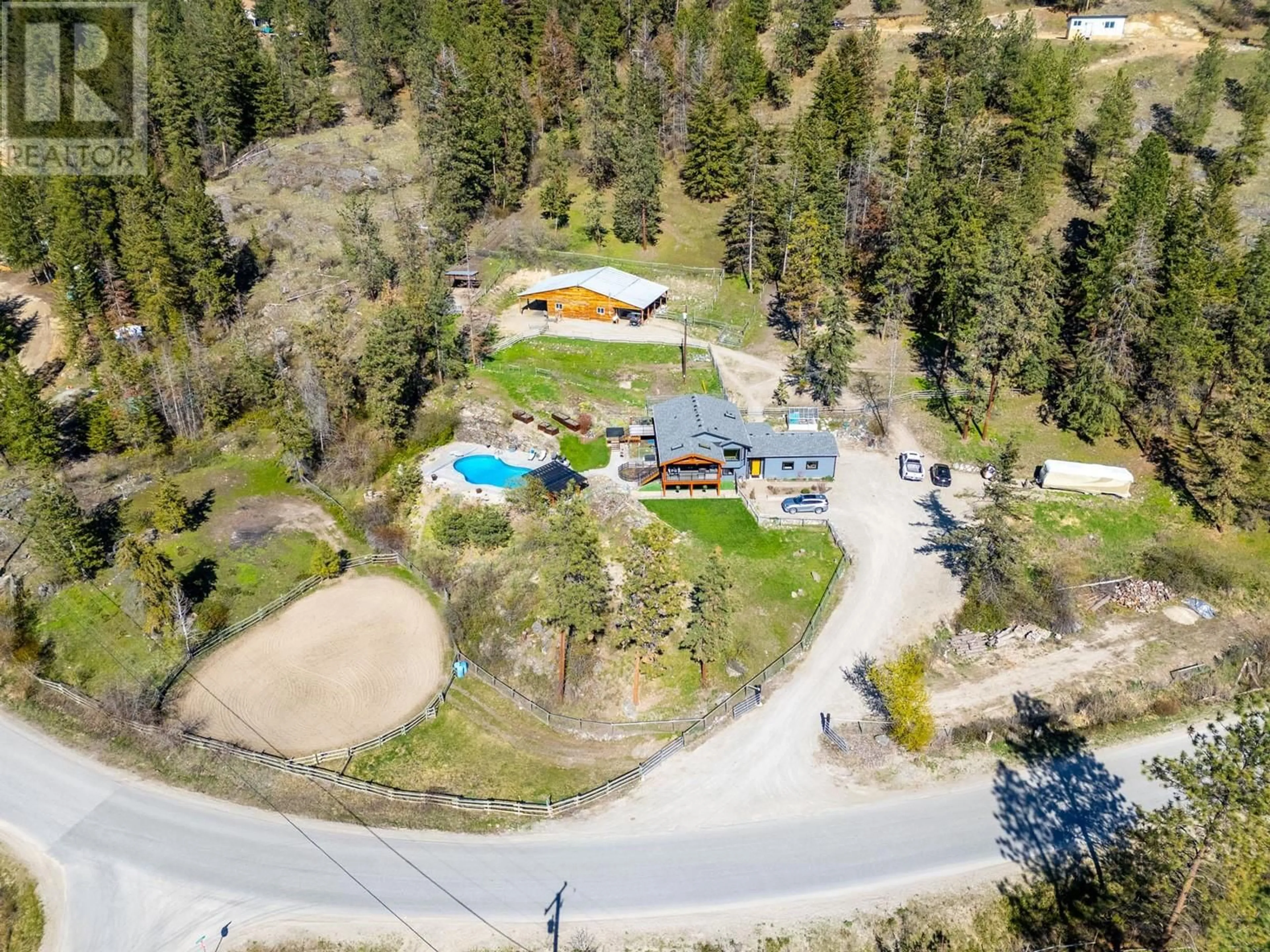 A pic from outside/outdoor area/front of a property/back of a property/a pic from drone, unknown for 6025 FARMERS DRIVE, Kelowna British Columbia V1P1A3
