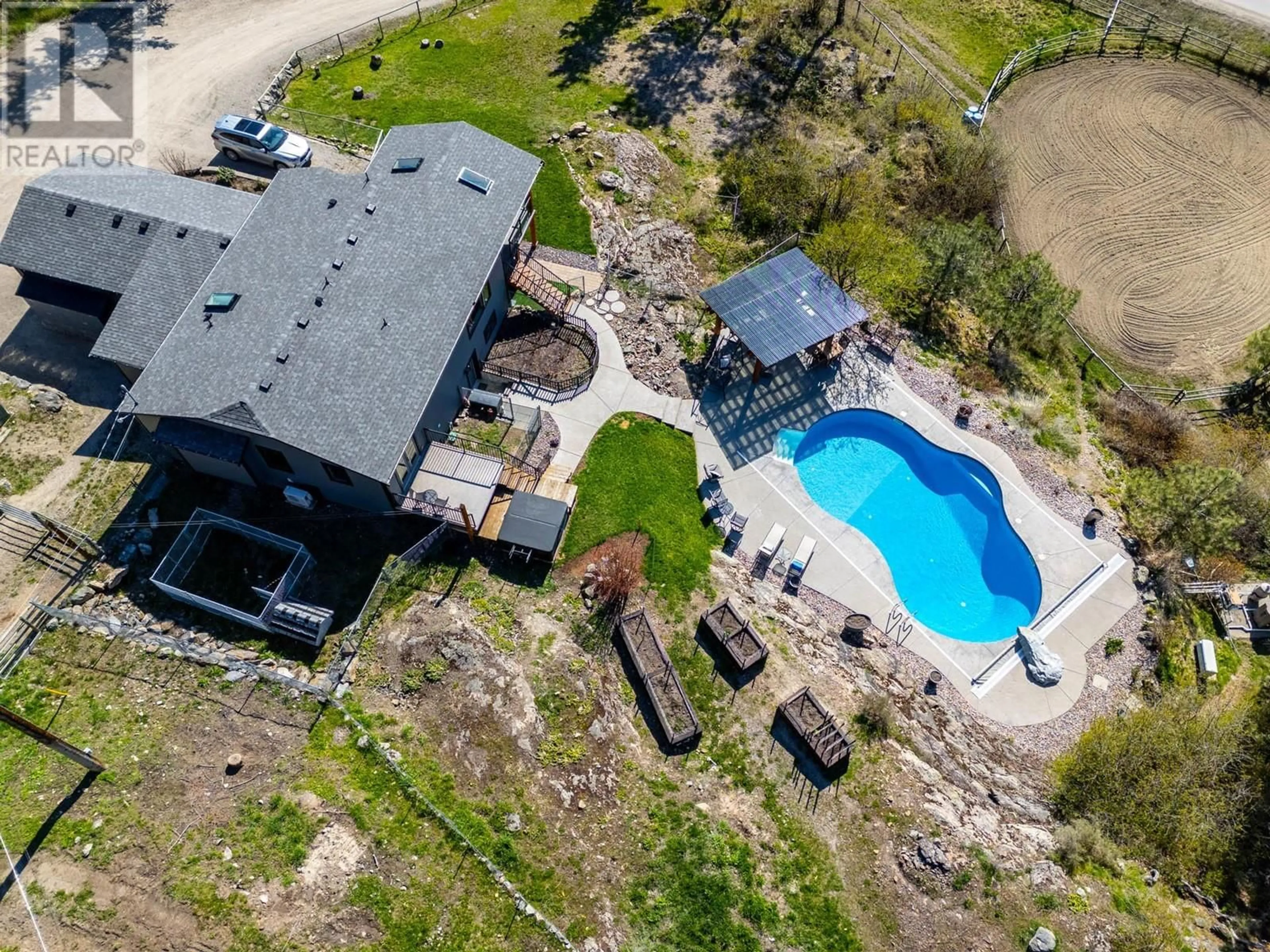 A pic from outside/outdoor area/front of a property/back of a property/a pic from drone, water/lake/river/ocean view for 6025 FARMERS DRIVE, Kelowna British Columbia V1P1A3