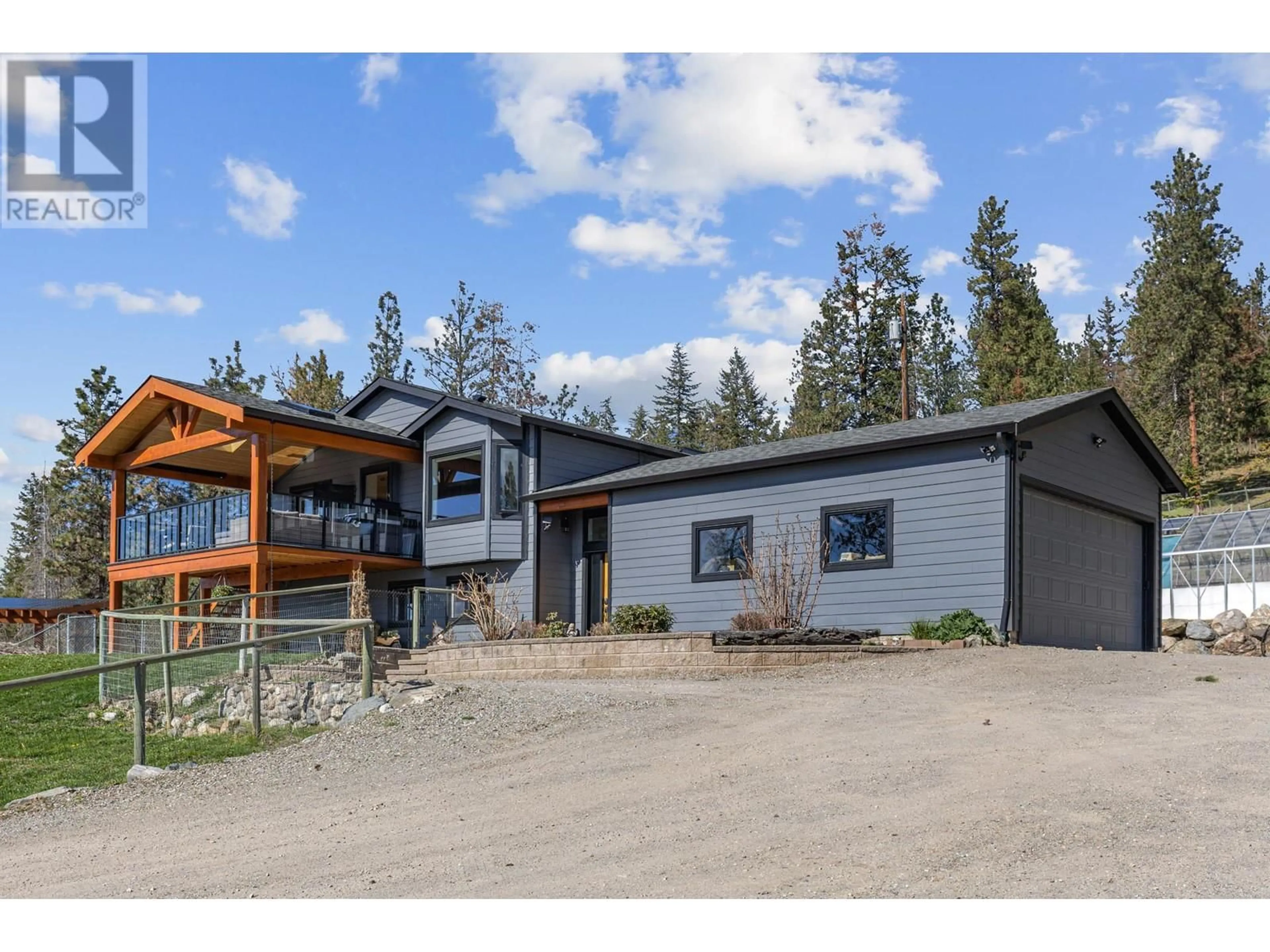 A pic from outside/outdoor area/front of a property/back of a property/a pic from drone, mountain view for 6025 FARMERS DRIVE, Kelowna British Columbia V1P1A3
