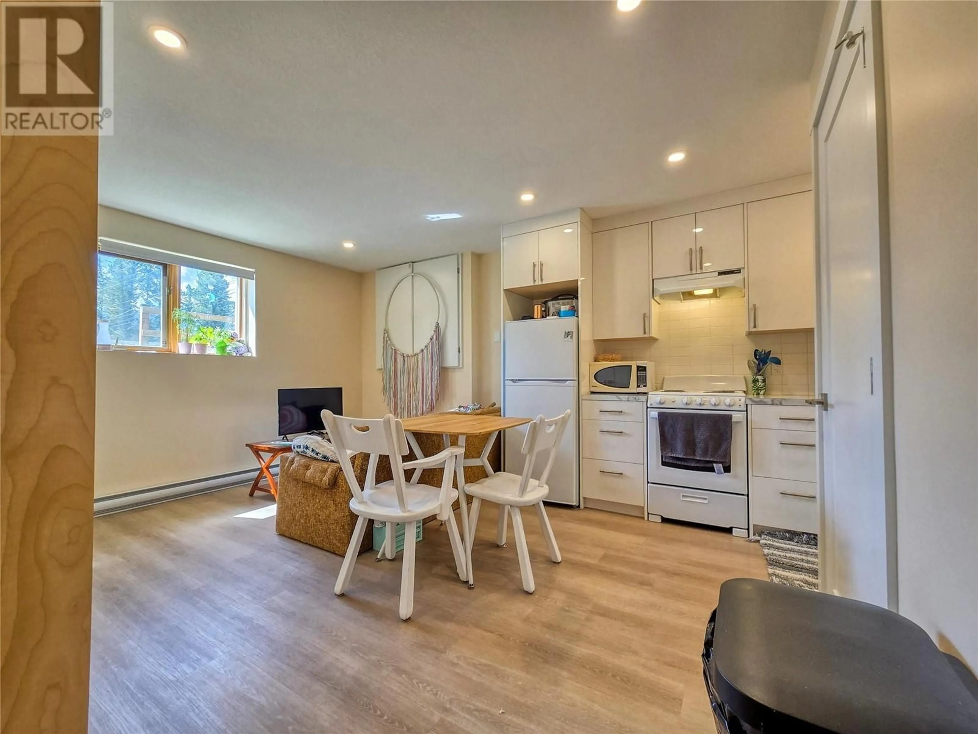 Open concept kitchen, wood/laminate floor for 2031 13TH AVENUE, Invermere British Columbia V0A1K4