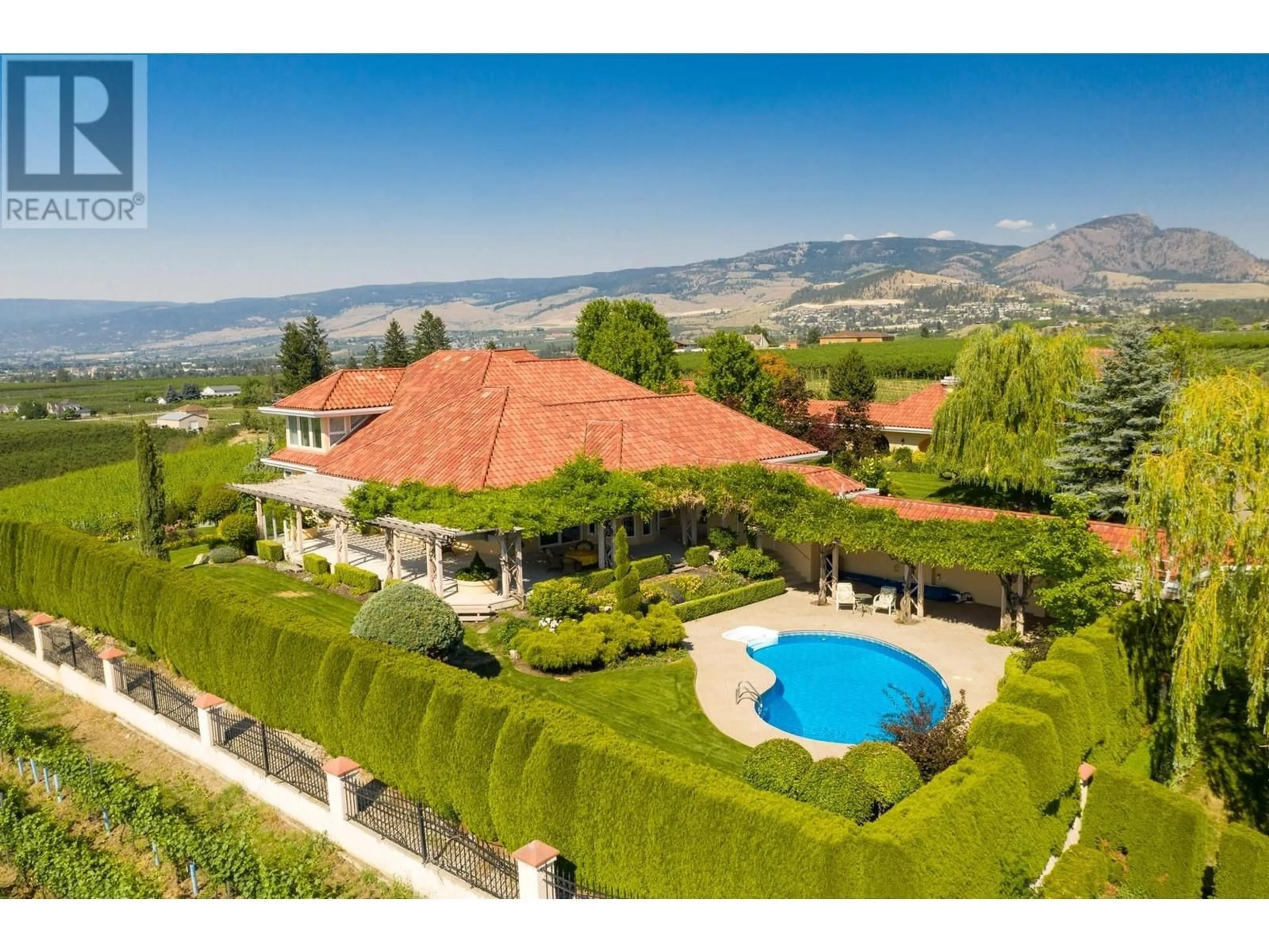 A pic from outside/outdoor area/front of a property/back of a property/a pic from drone, mountain view for 3240 POOLEY ROAD, Kelowna British Columbia V1W4G7