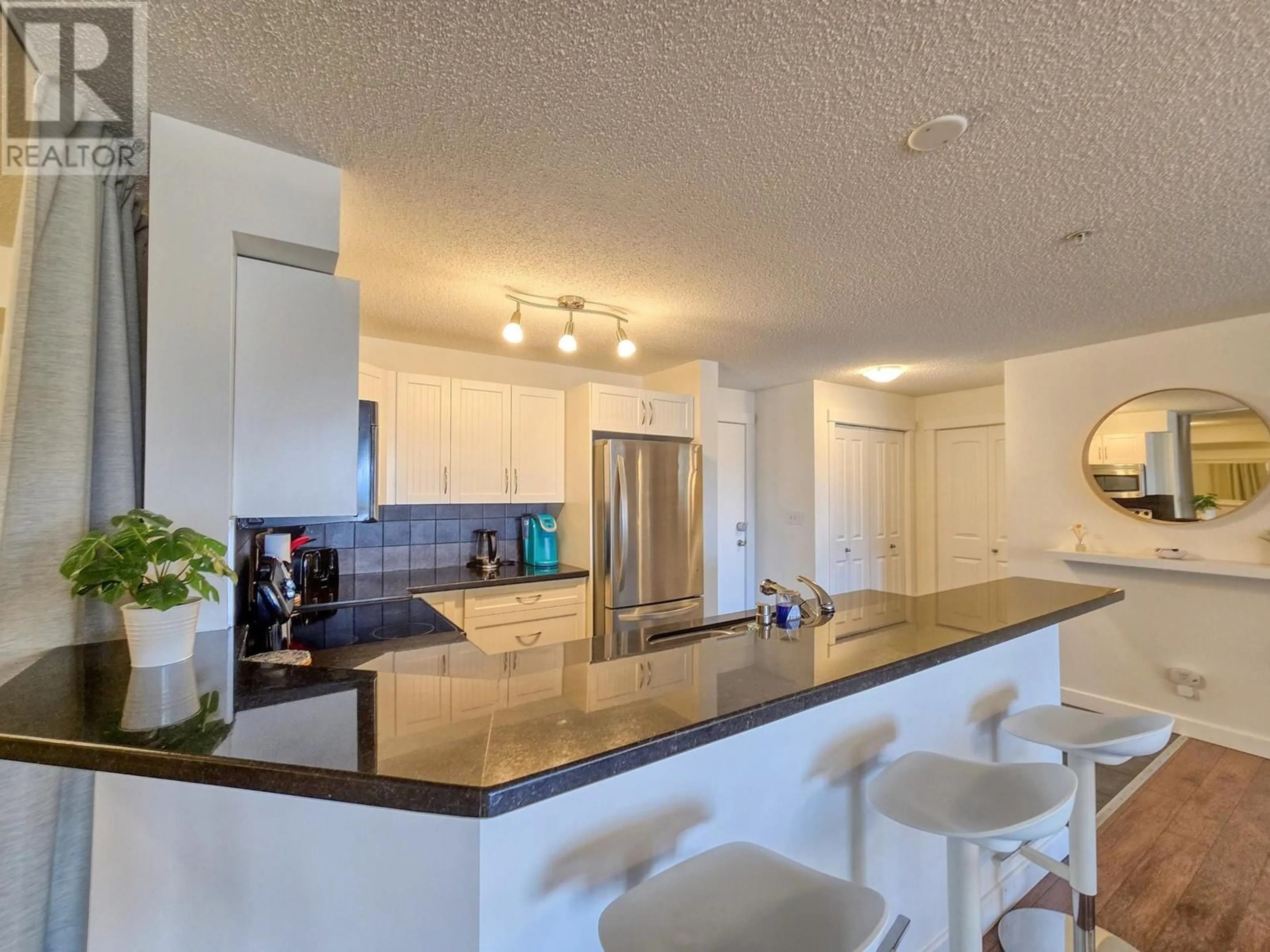Open concept kitchen, ceramic/tile floor for 1306 - 205 THIRD AVENUE, Invermere British Columbia V0A1K7