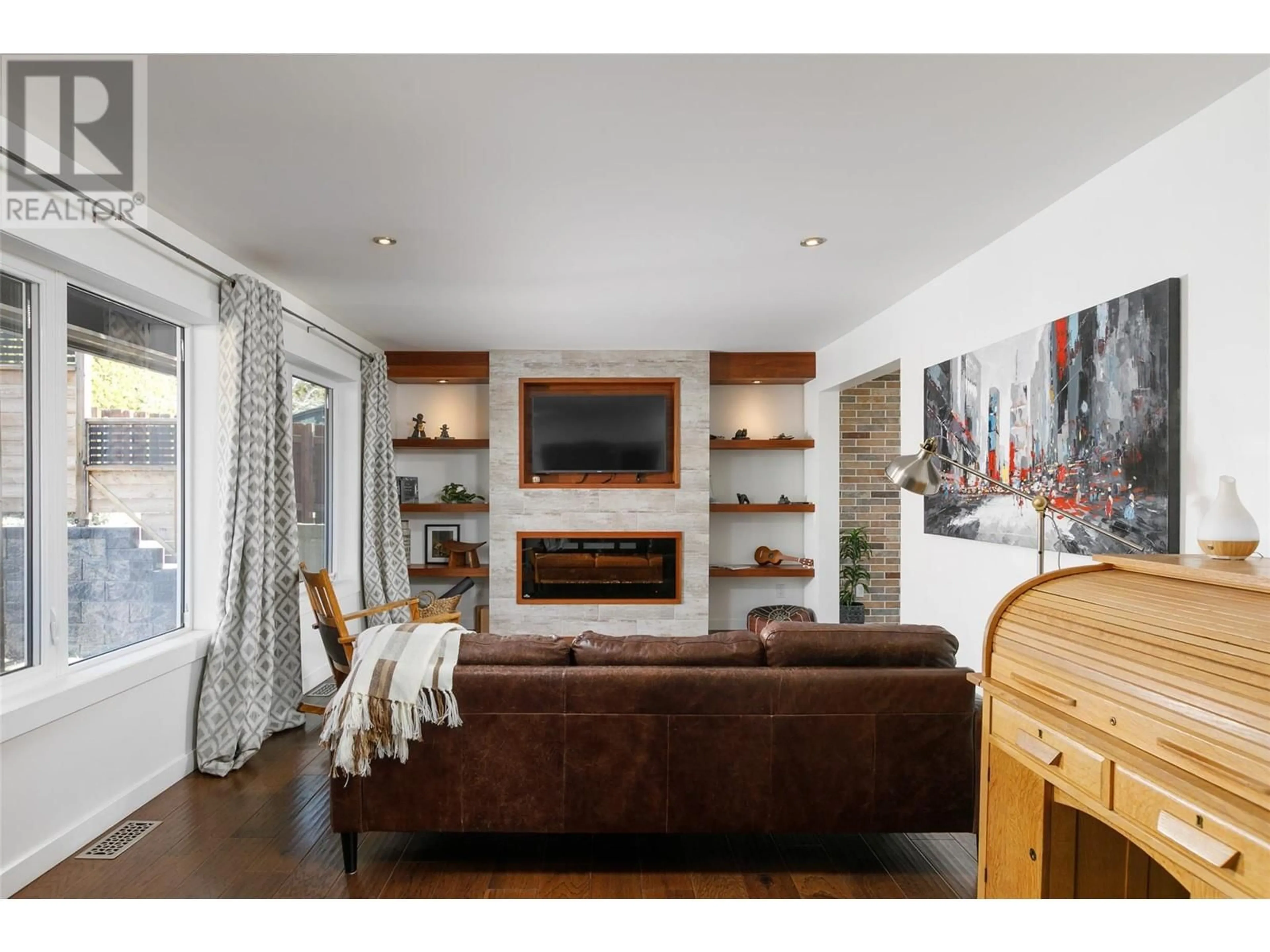Living room with furniture, wood/laminate floor for 3355 MCGINNIS ROAD, West Kelowna British Columbia V4T1B5