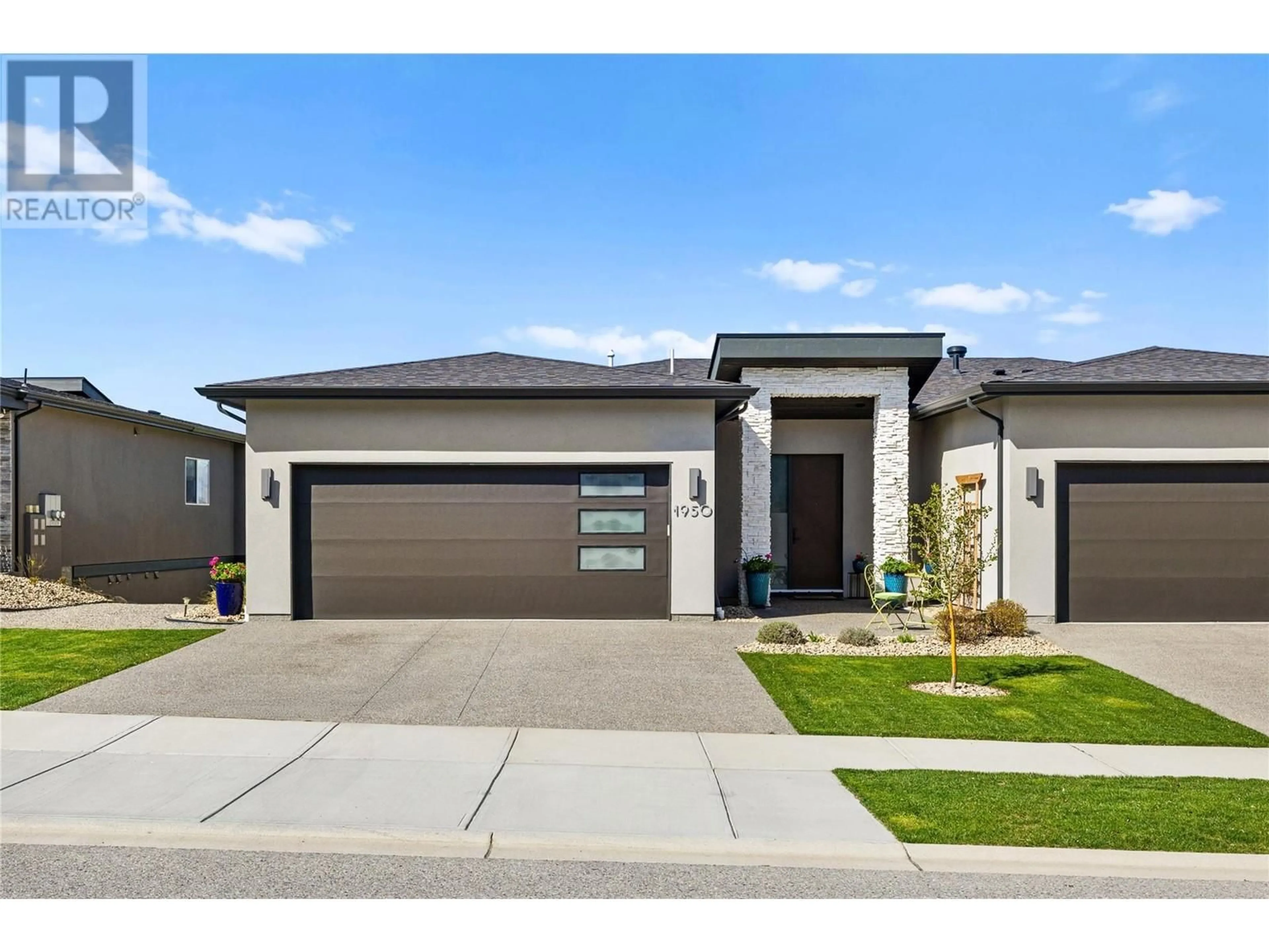 Home with brick exterior material, street for 1950 TALLGRASS TRAIL, Kelowna British Columbia V1P1T7