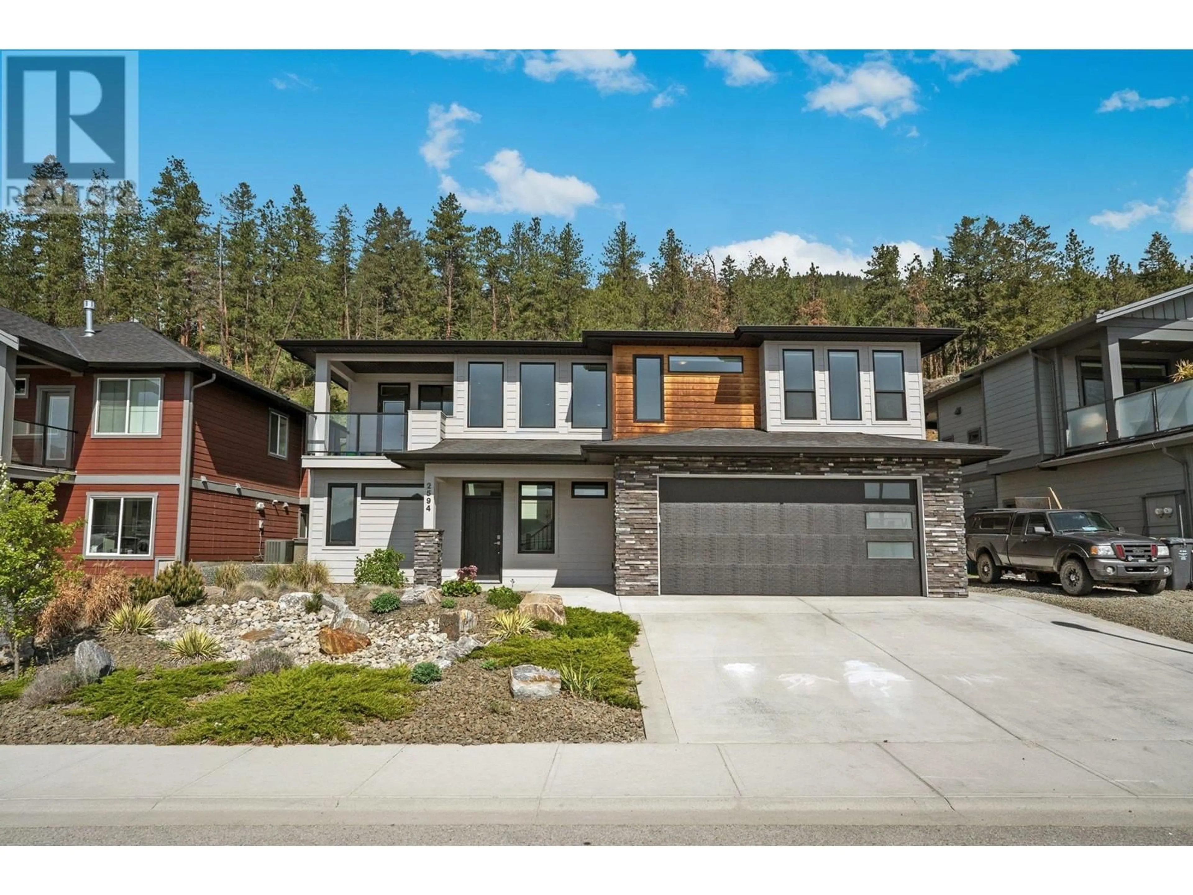 Home with brick exterior material, street for 2594 CROWN CREST DRIVE, West Kelowna British Columbia V4T3N3