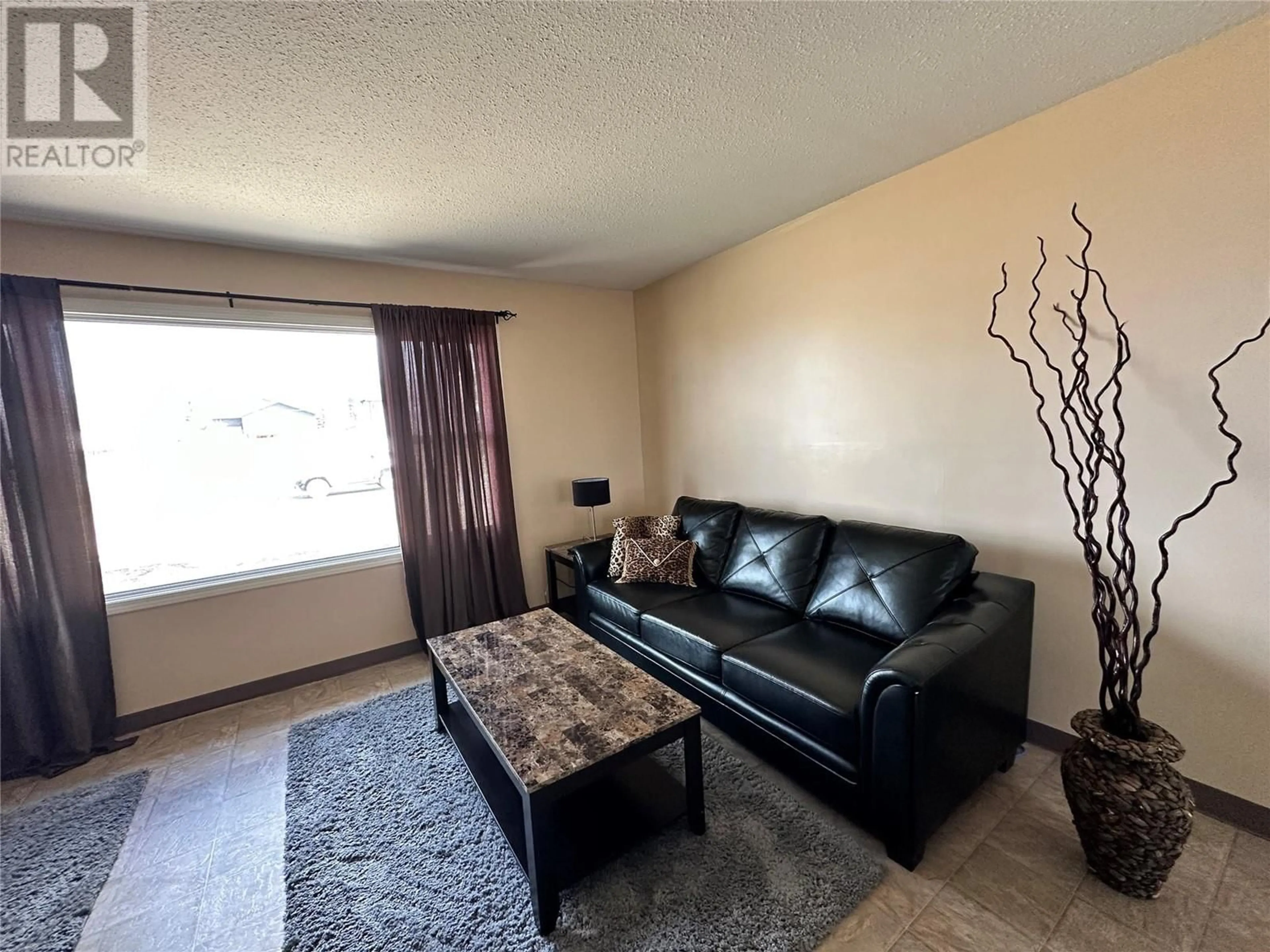 Living room with furniture, unknown for 409 100 AVENUE, Dawson Creek British Columbia V1G1V6
