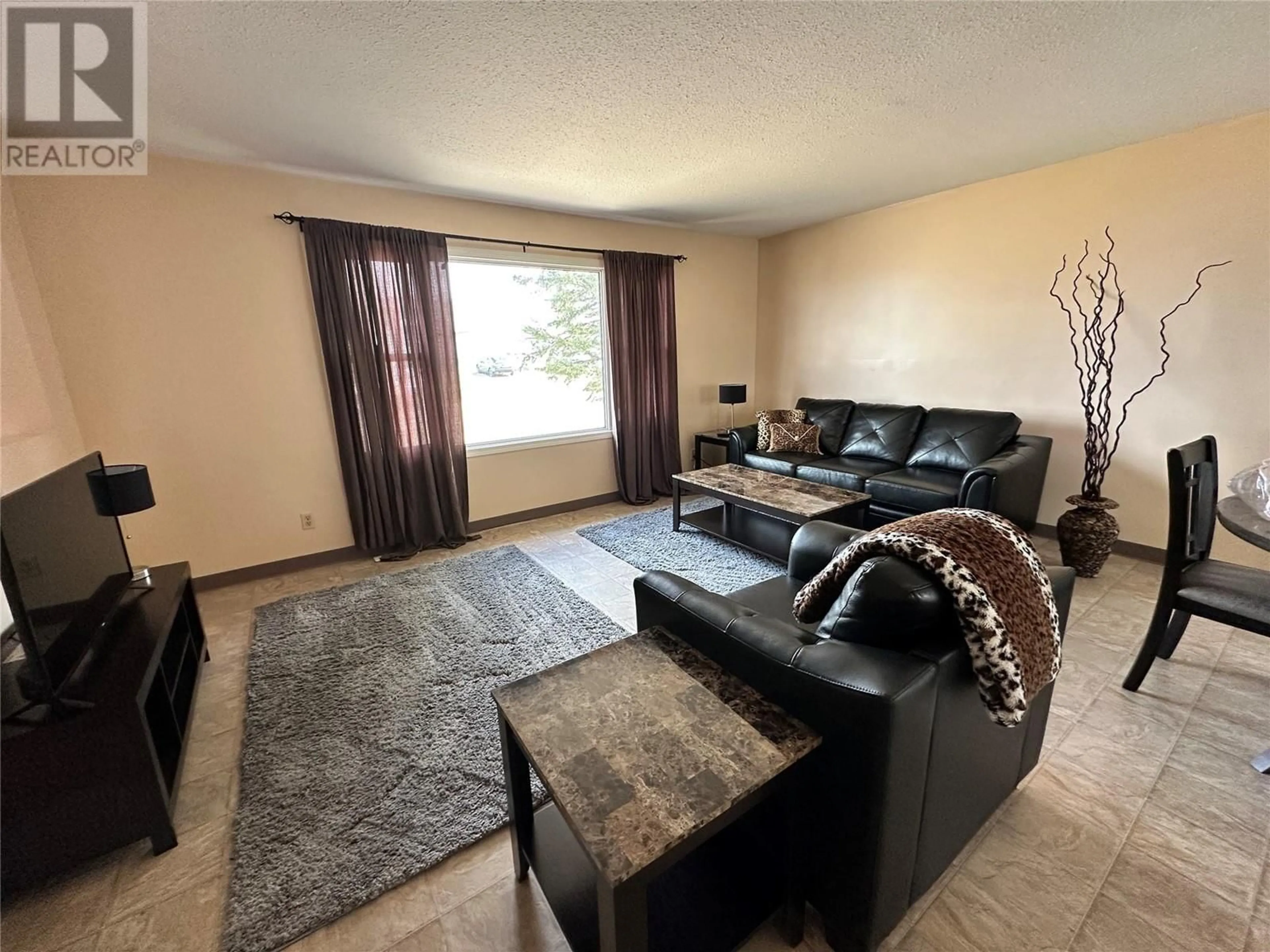 Living room with furniture, unknown for 409 100 AVENUE, Dawson Creek British Columbia V1G1V6