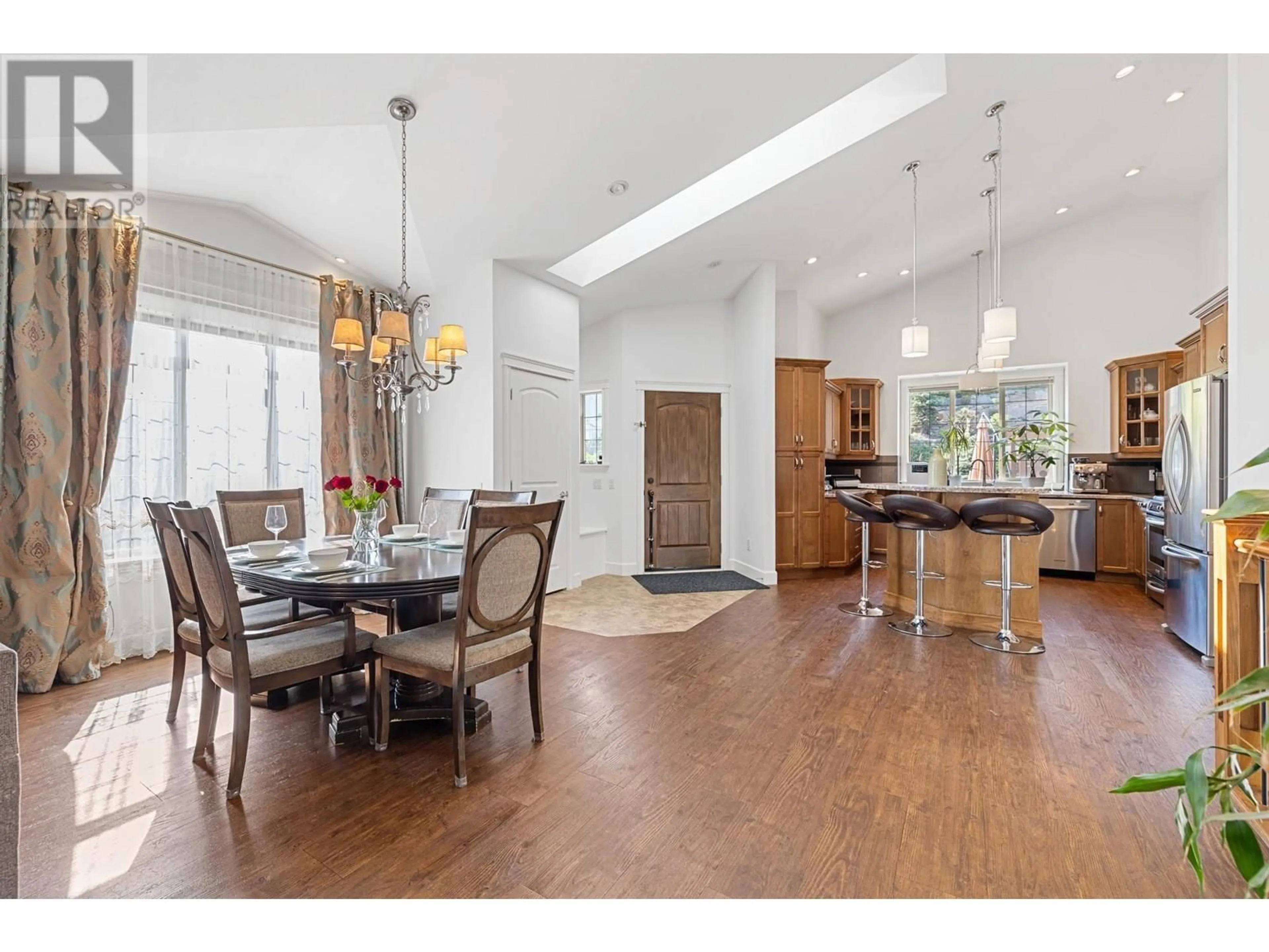 Open concept kitchen, wood/laminate floor for 374 TRUMPETER COURT, Kelowna British Columbia V1W5J4