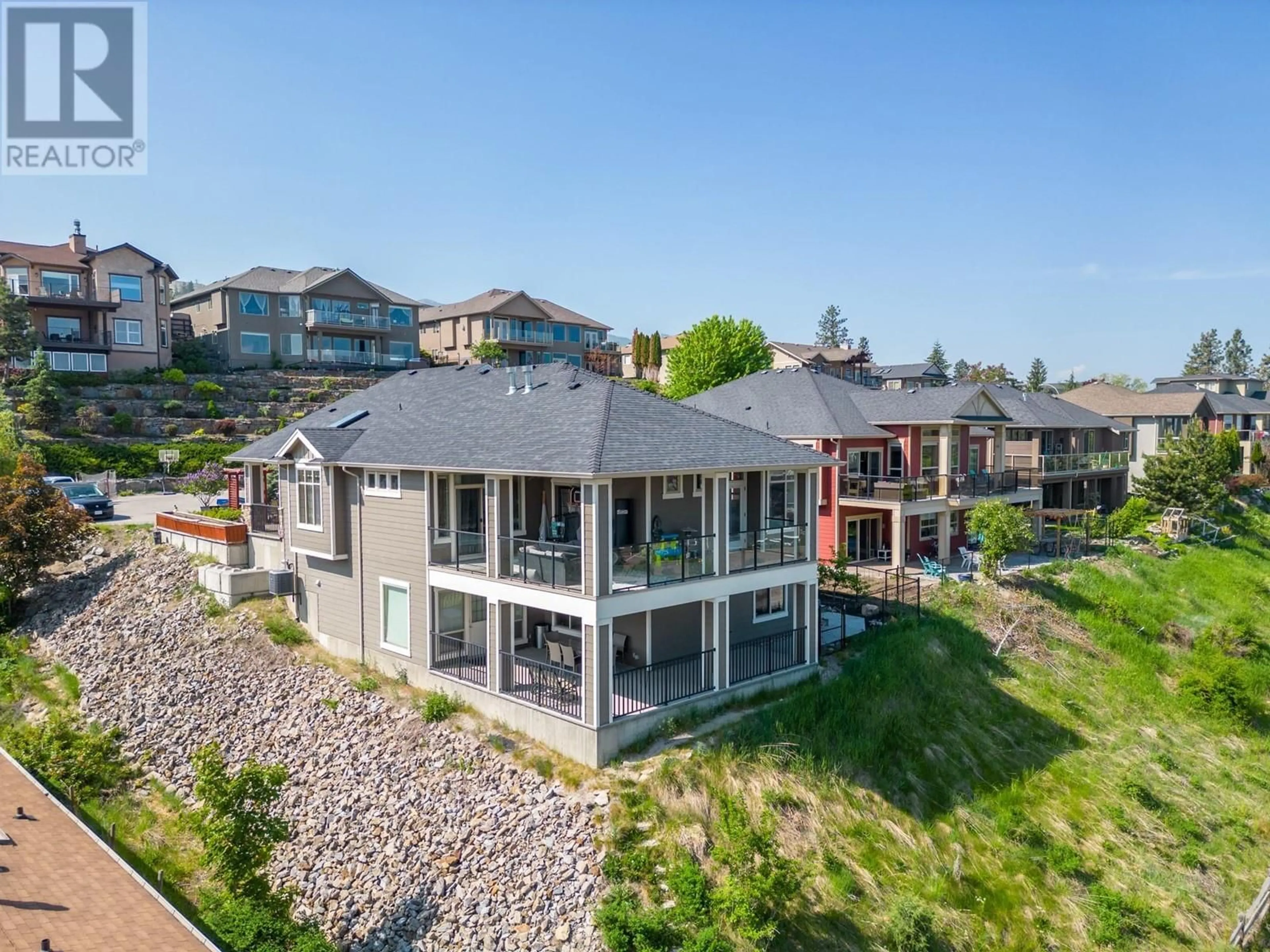 A pic from outside/outdoor area/front of a property/back of a property/a pic from drone, mountain view for 374 TRUMPETER COURT, Kelowna British Columbia V1W5J4