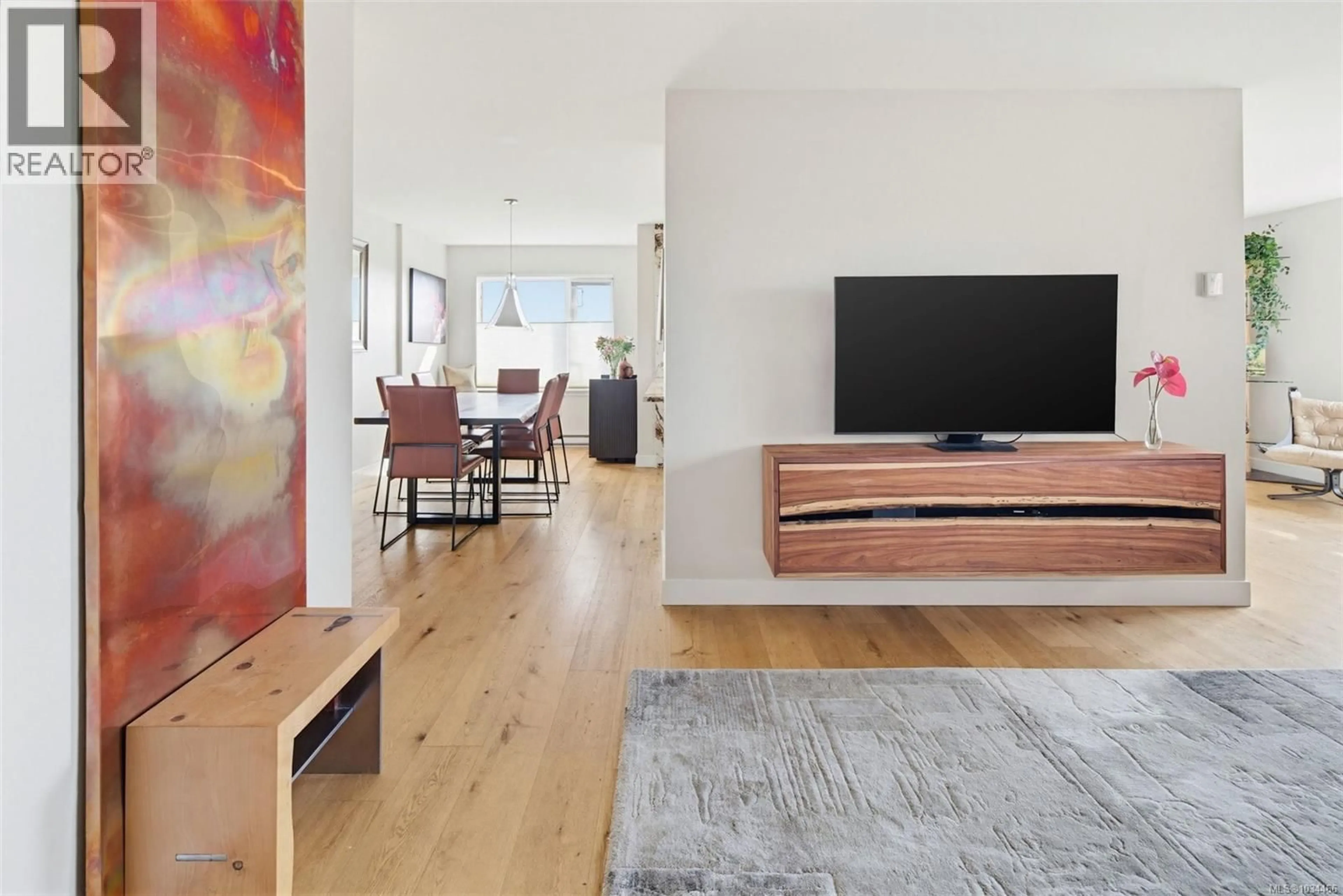 Living room with furniture, wood/laminate floor for 602 - 103 GORGE ROAD EAST, Victoria British Columbia V9A6Z2