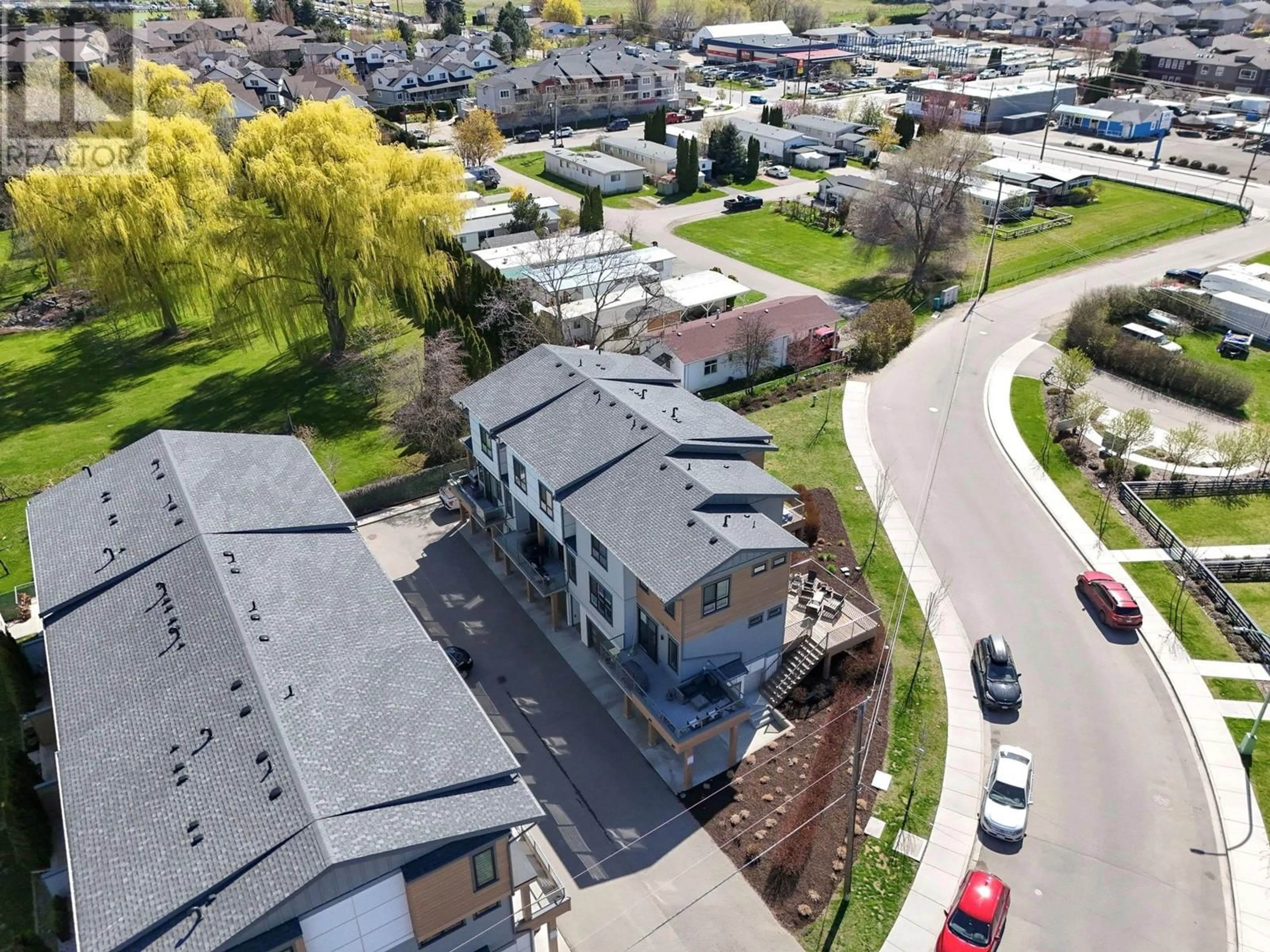 A pic from outside/outdoor area/front of a property/back of a property/a pic from drone, street for 403 - 11581 ROGERS ROAD, Lake Country British Columbia V4V1X8