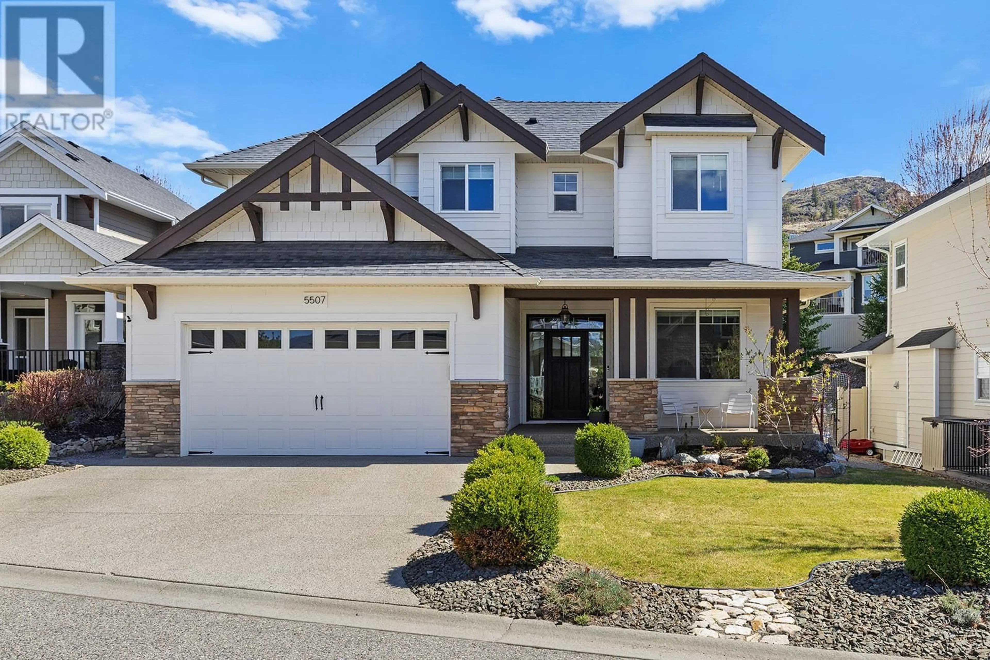 Home with vinyl exterior material, street for 5507 LEE LANE, Kelowna British Columbia V1W5H2