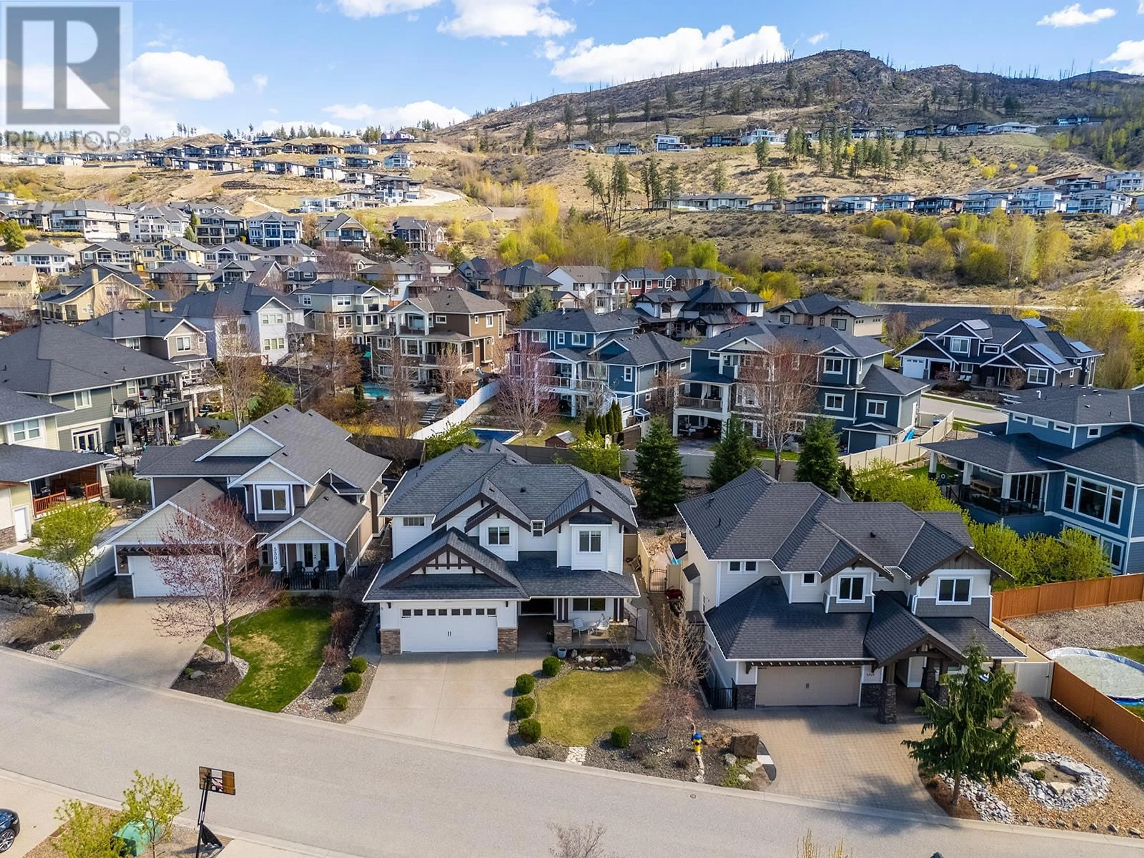 A pic from outside/outdoor area/front of a property/back of a property/a pic from drone, mountain view for 5507 LEE LANE, Kelowna British Columbia V1W5H2