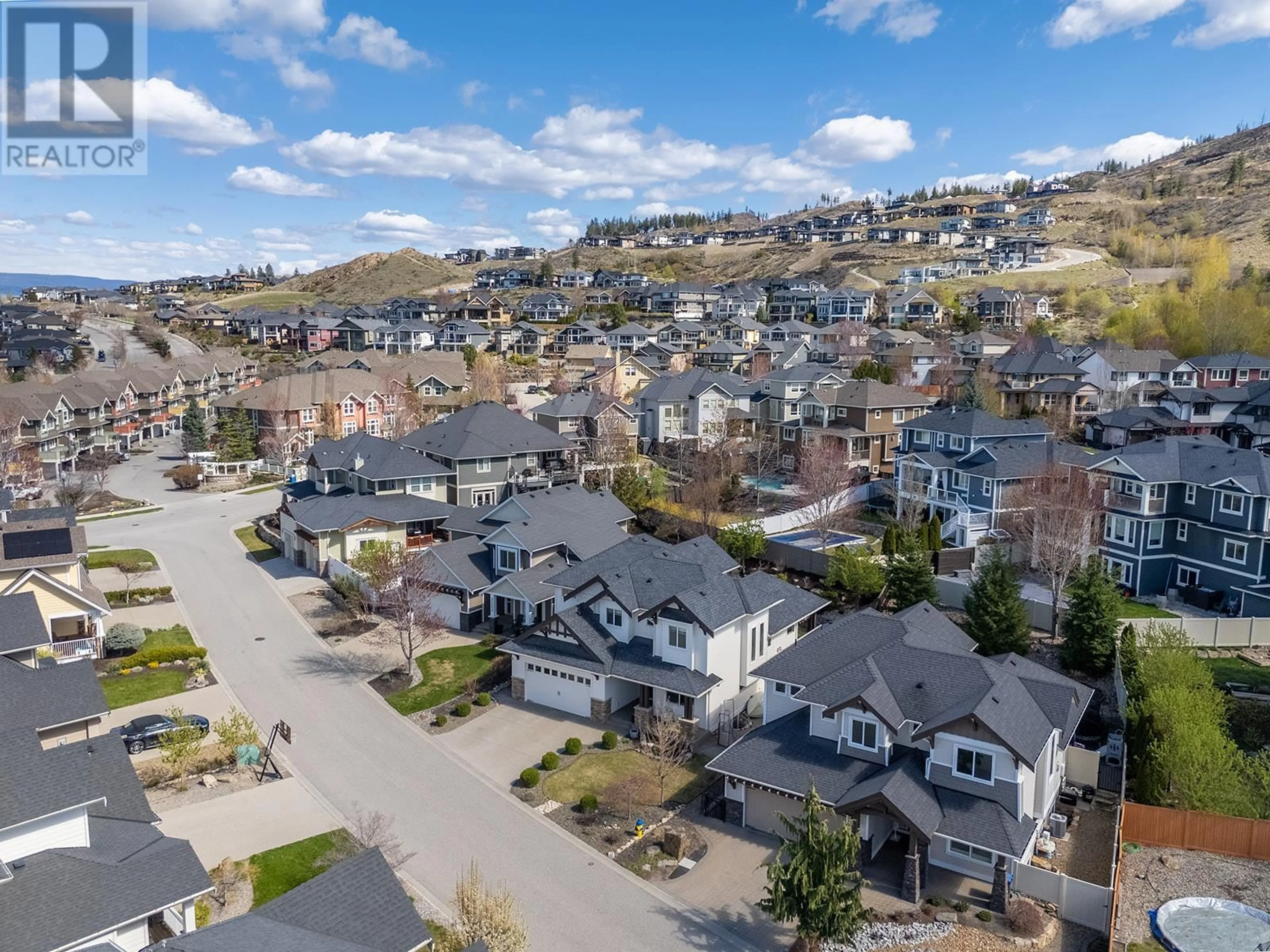 A pic from outside/outdoor area/front of a property/back of a property/a pic from drone, mountain view for 5507 LEE LANE, Kelowna British Columbia V1W5H2