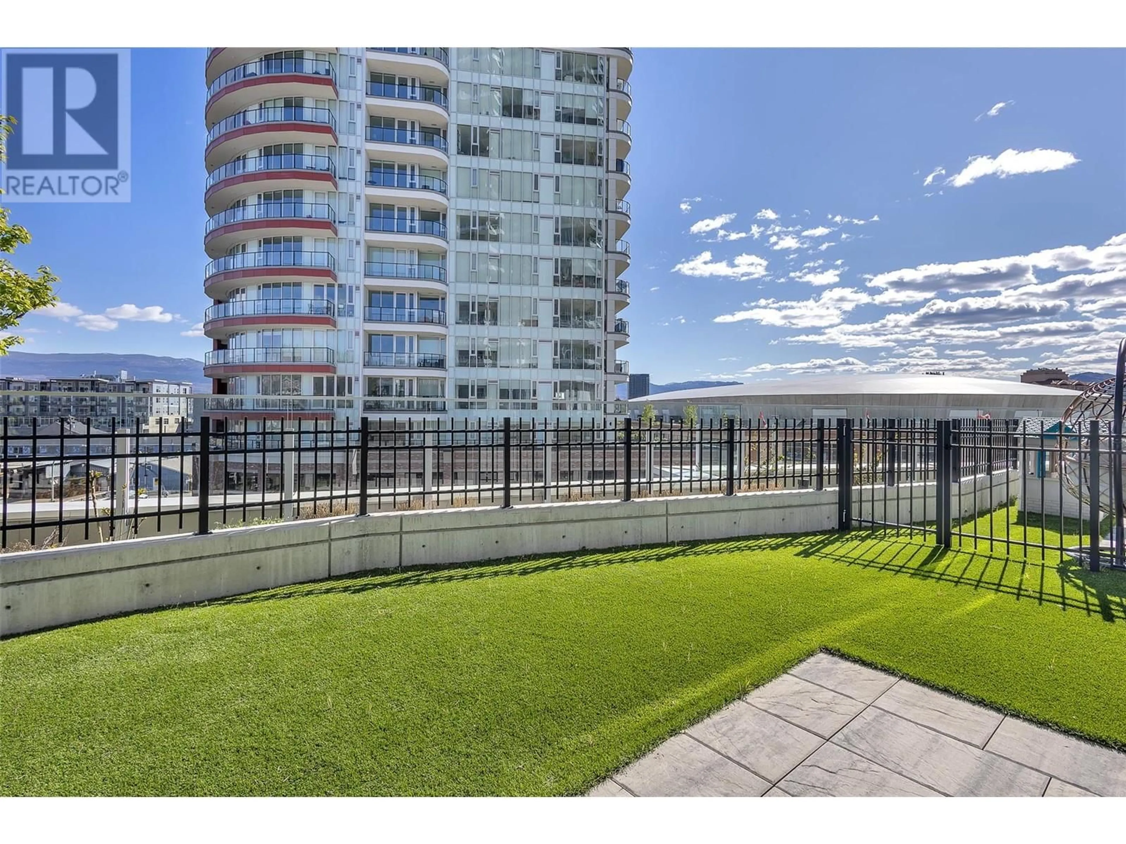 Patio, city buildings view from balcony for 407 - 1191 SUNSET DRIVE, Kelowna British Columbia V1Y0J4