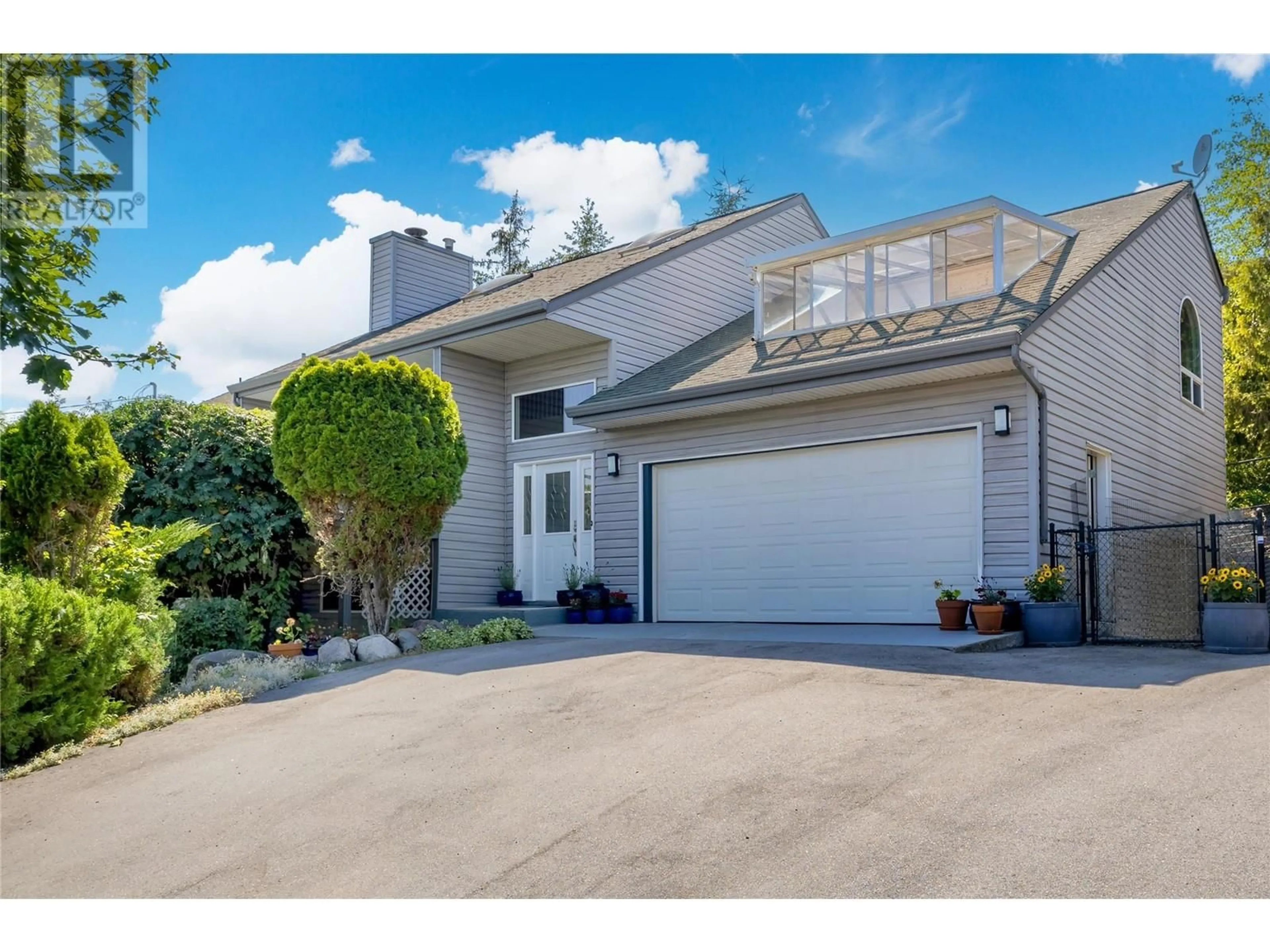 Home with vinyl exterior material, street for 3964 ANGUS DRIVE, West Kelowna British Columbia V4T2K1