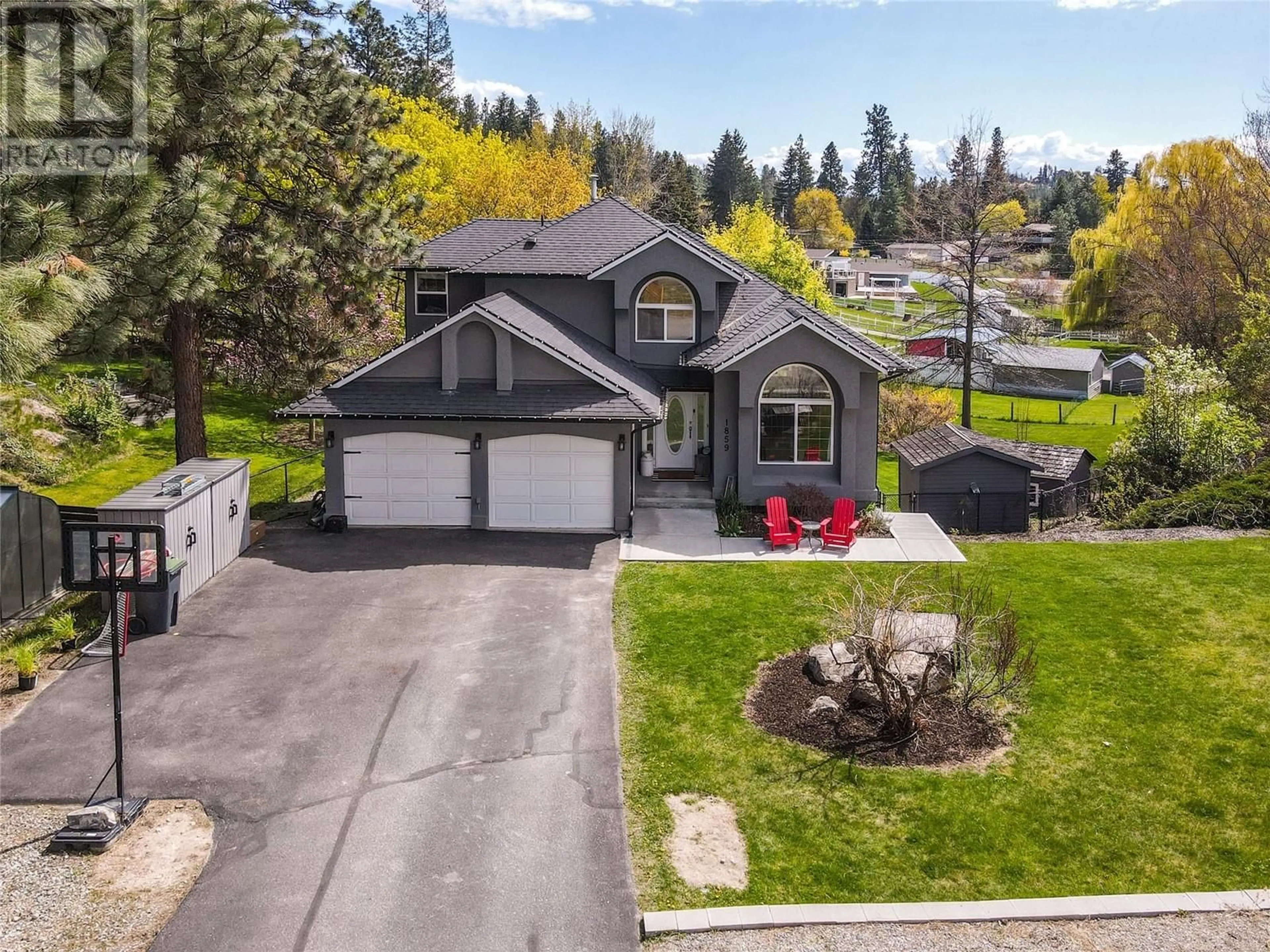 A pic from outside/outdoor area/front of a property/back of a property/a pic from drone, street for 1859 KLONDIKE COURT, Lake Country British Columbia V4V1P2