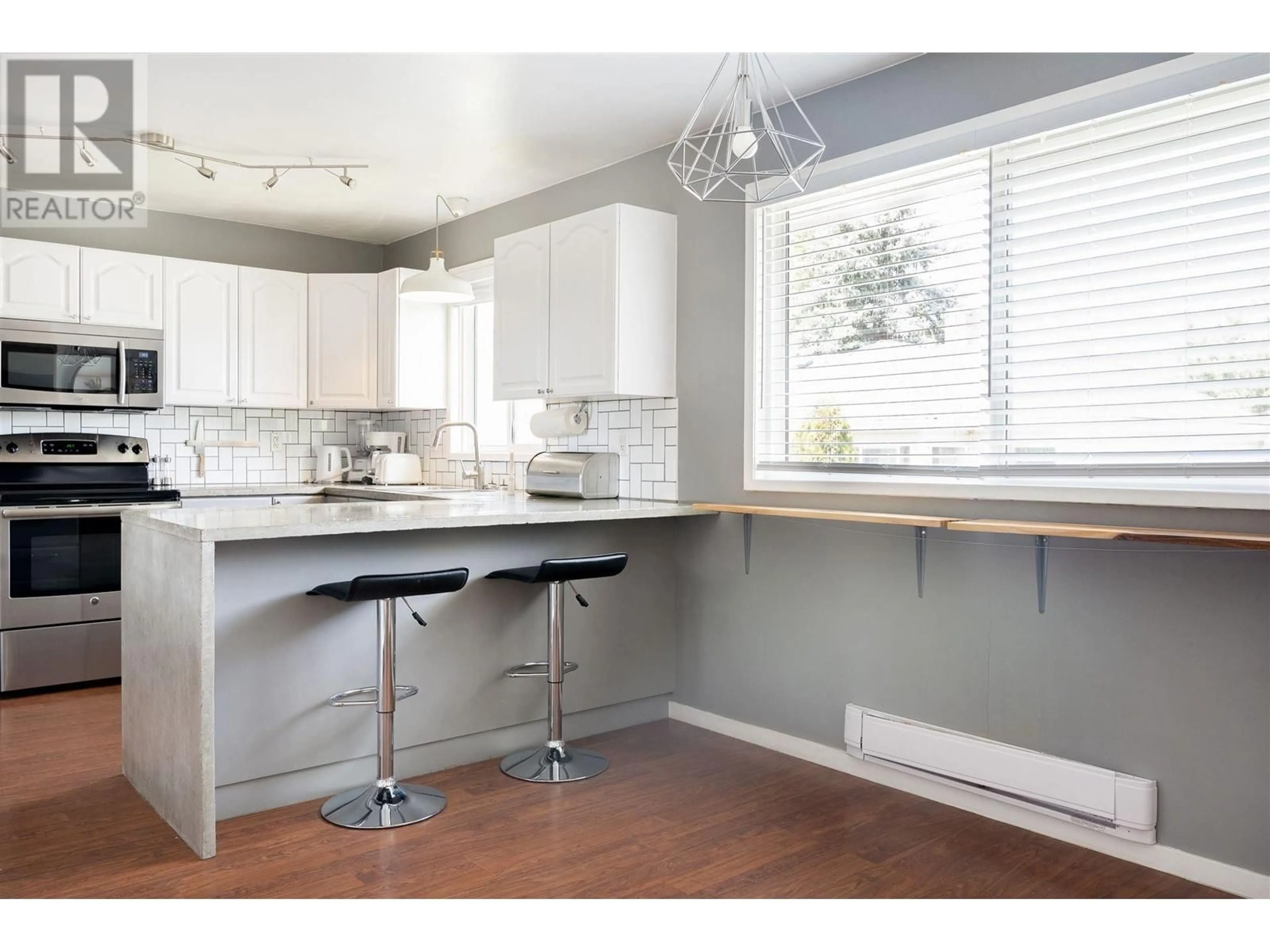 Open concept kitchen, wood/laminate floor for 2 - 1343 HIGHLAND DRIVE SOUTH, Kelowna British Columbia V1Y3V9