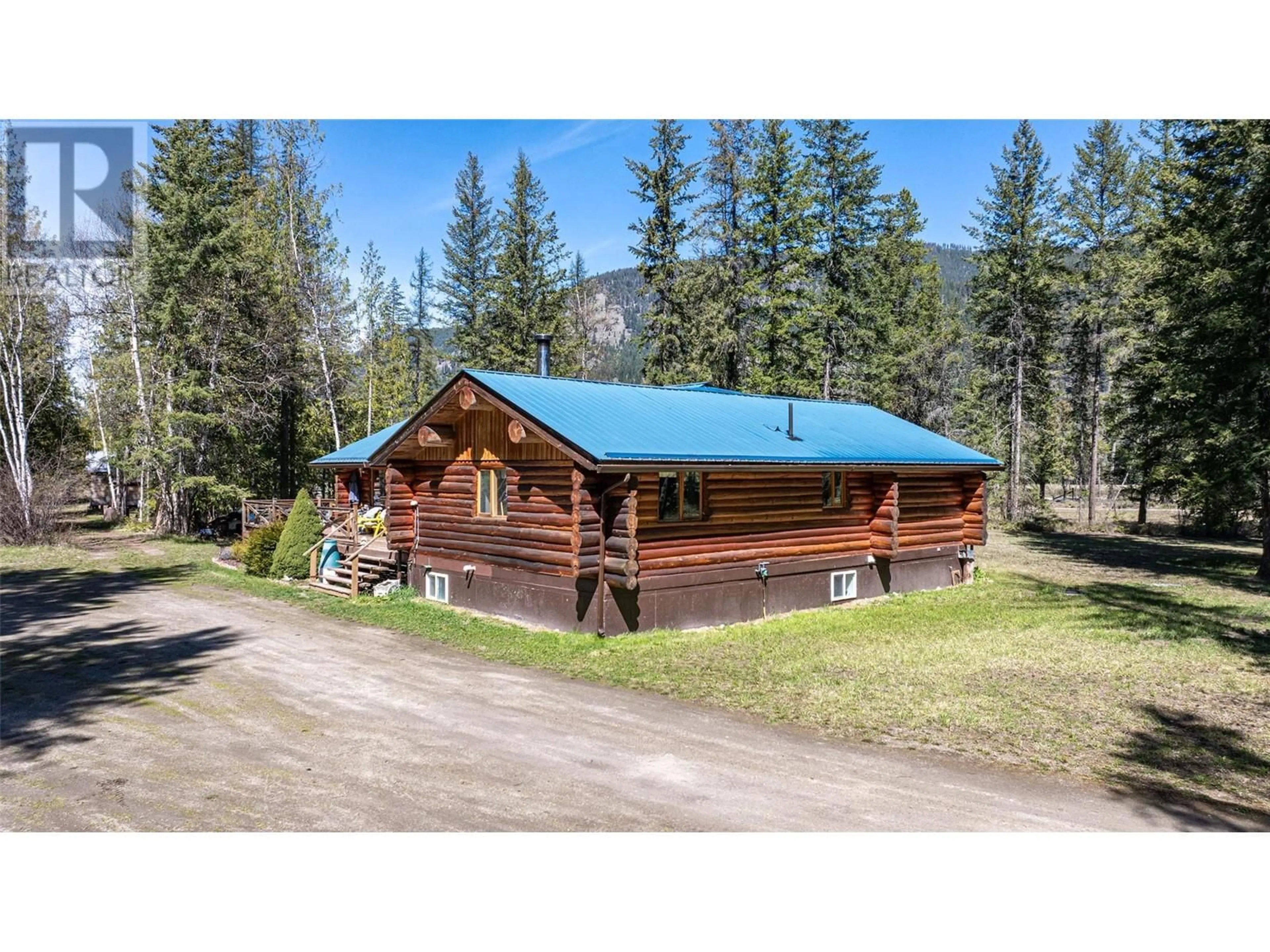 A pic from outside/outdoor area/front of a property/back of a property/a pic from drone, mountain view for 1474 6 HIGHWAY, Cherryville British Columbia V0E2G1