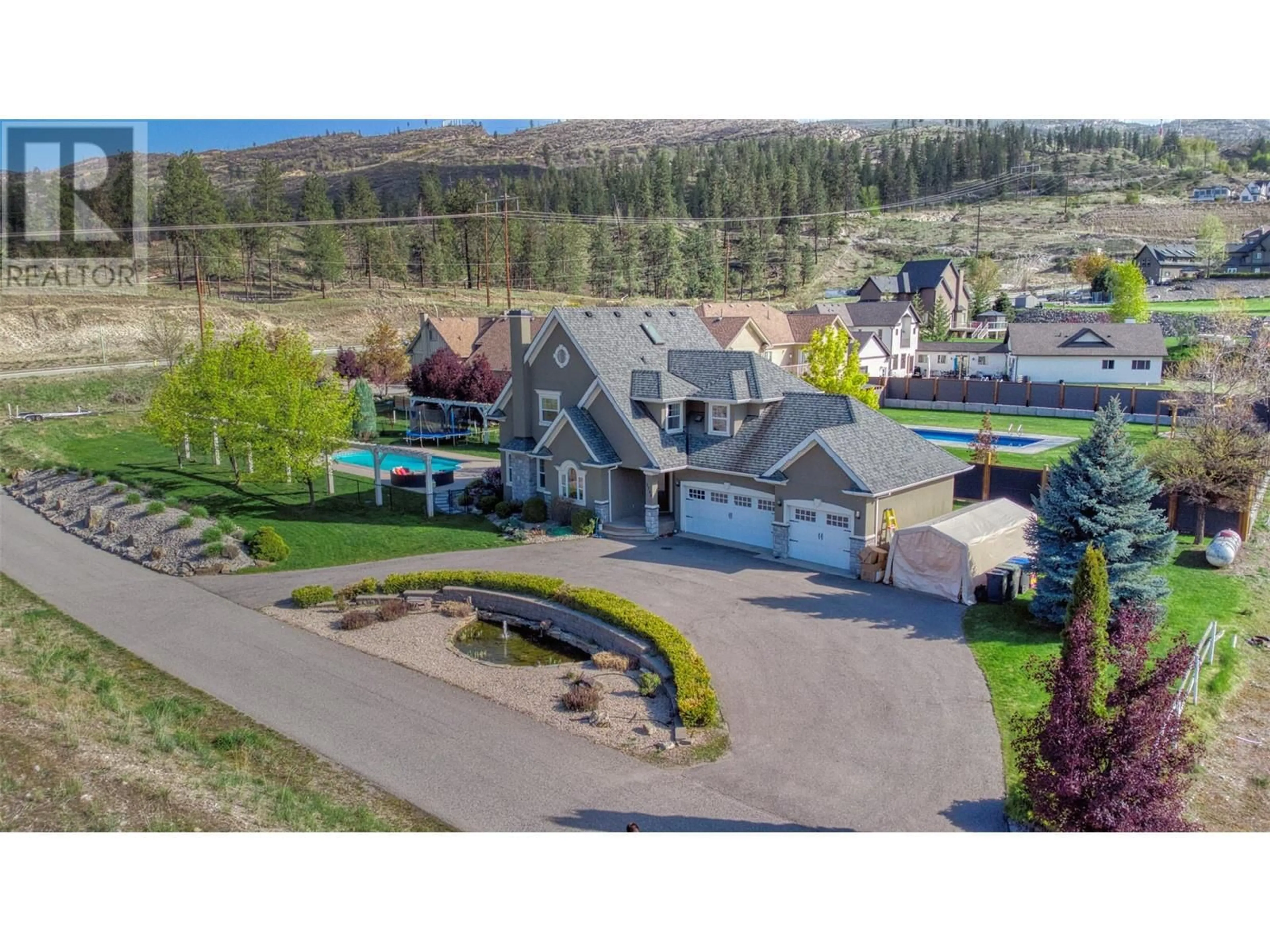 A pic from outside/outdoor area/front of a property/back of a property/a pic from drone, mountain view for 5308 UPPER MISSION DRIVE, Kelowna British Columbia V1W3S9