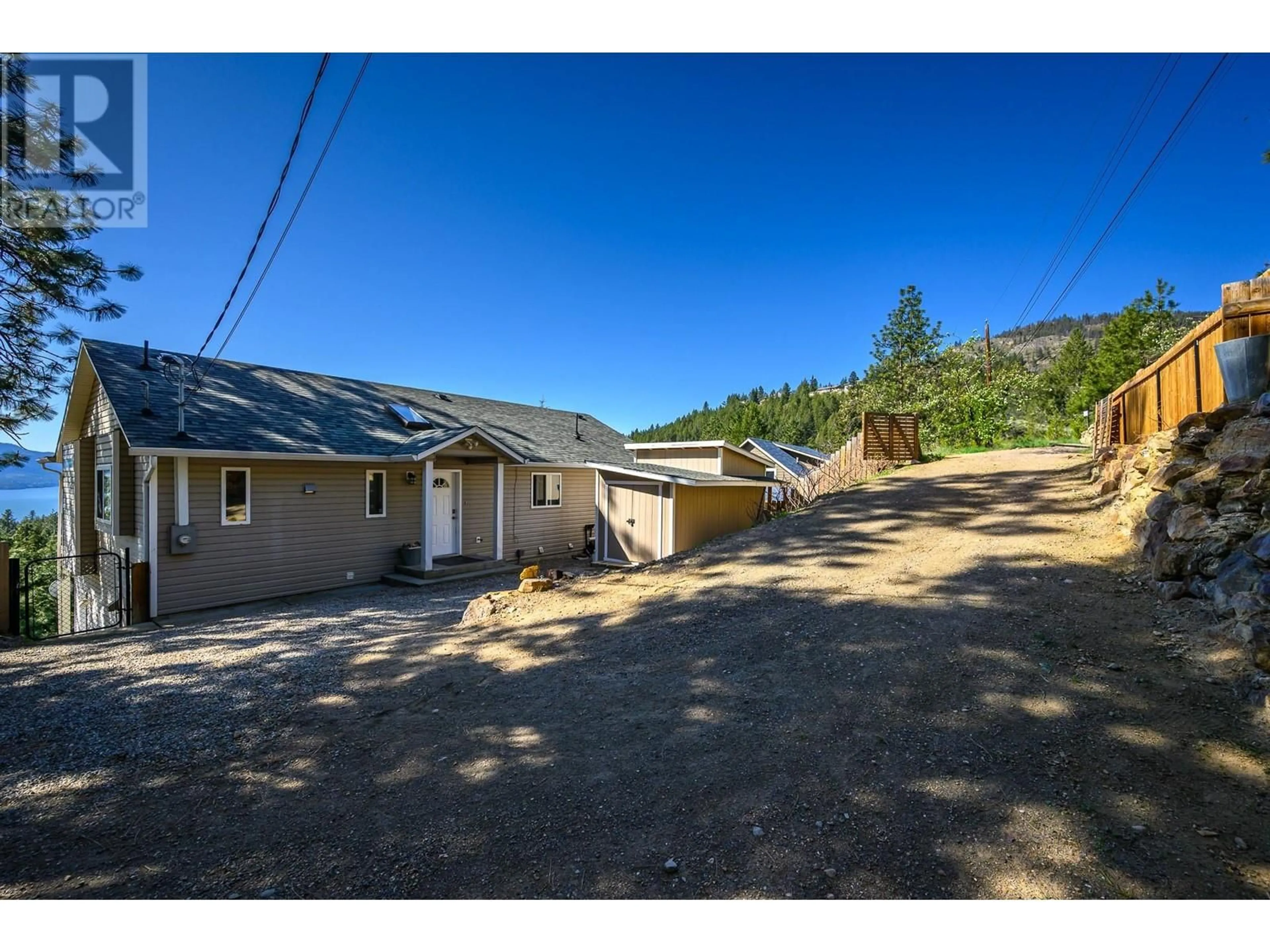 A pic from outside/outdoor area/front of a property/back of a property/a pic from drone, mountain view for 10778 PINECREST ROAD, Vernon British Columbia V1H2C1