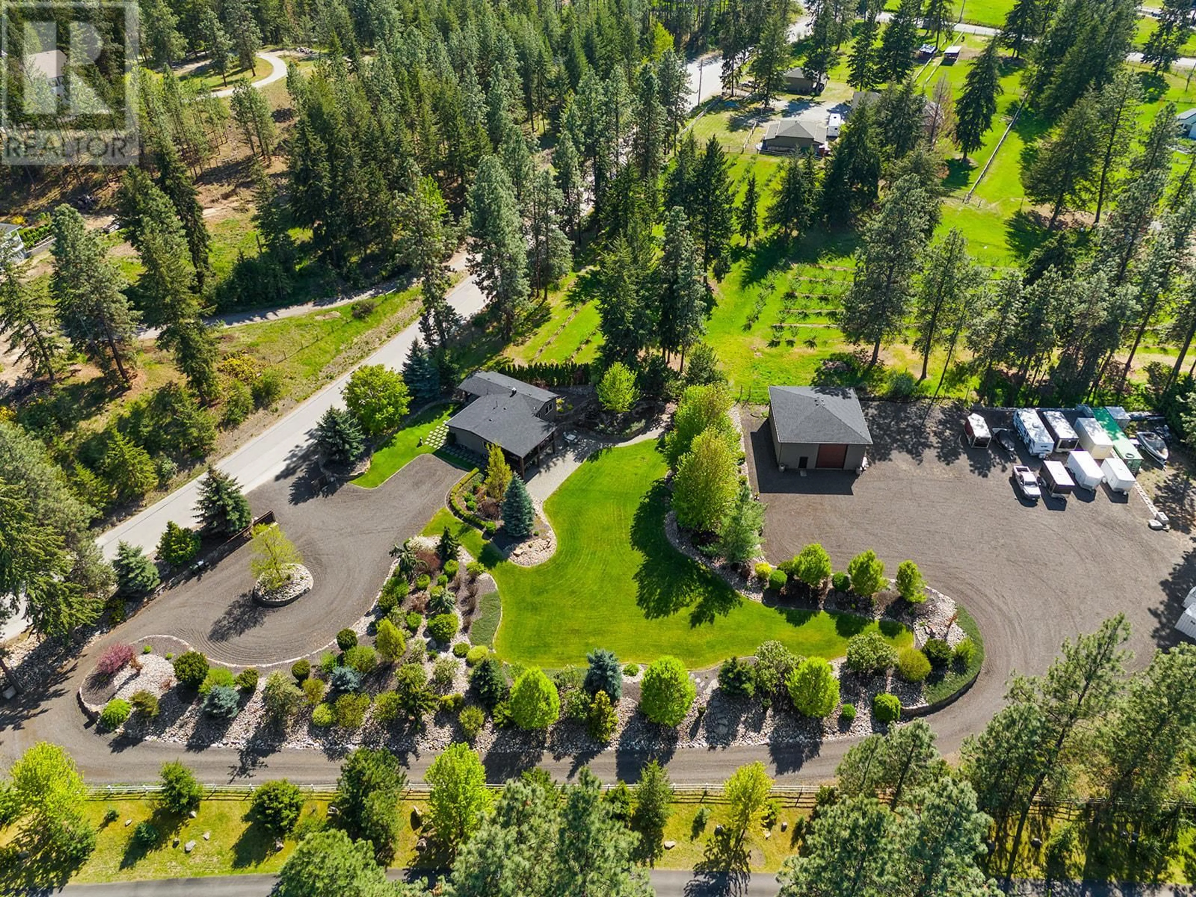 A pic from outside/outdoor area/front of a property/back of a property/a pic from drone, forest/trees view for 4190 MCCLAIN ROAD, Kelowna British Columbia V1W4E1