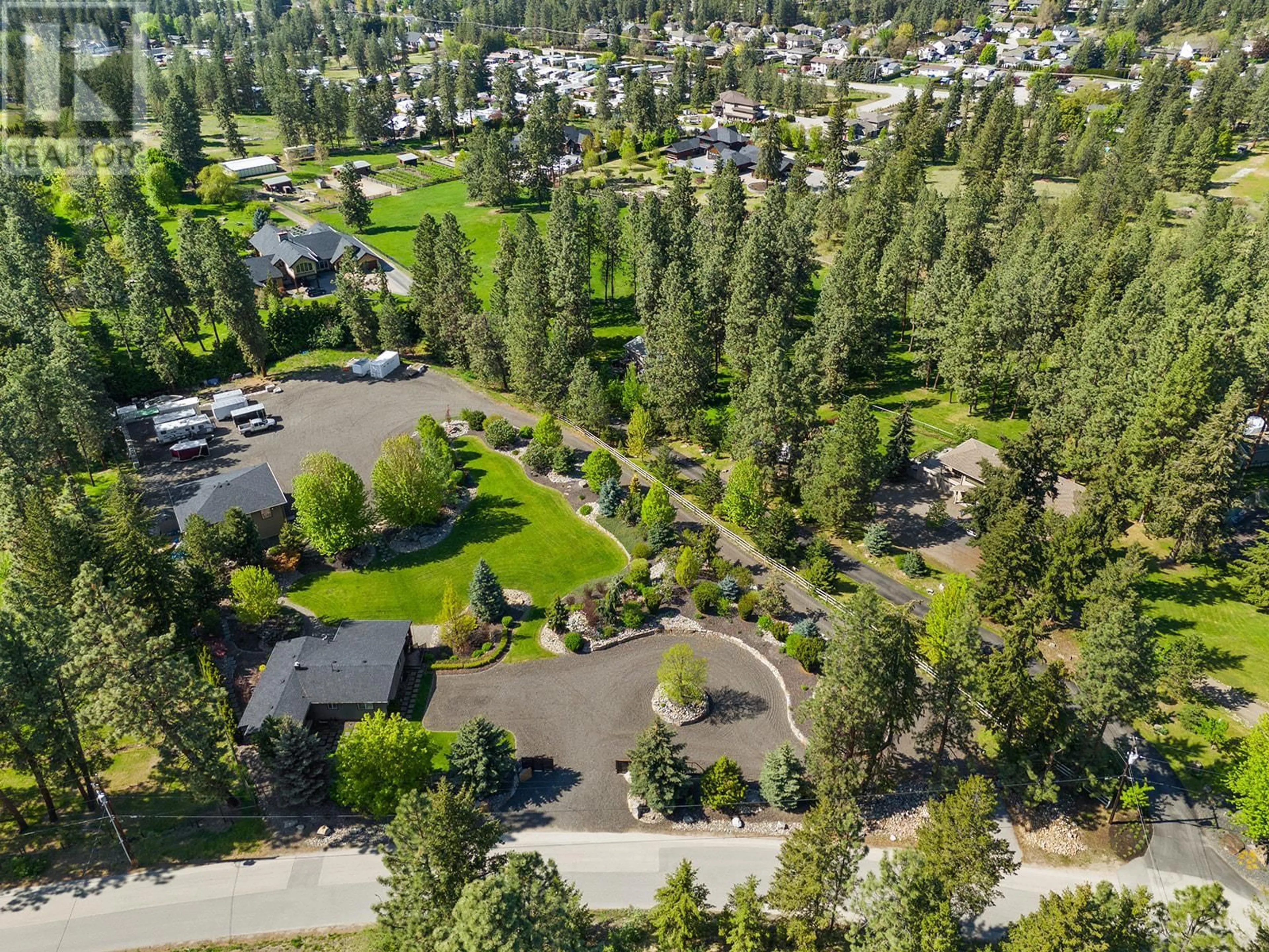A pic from outside/outdoor area/front of a property/back of a property/a pic from drone, forest/trees view for 4190 MCCLAIN ROAD, Kelowna British Columbia V1W4E1